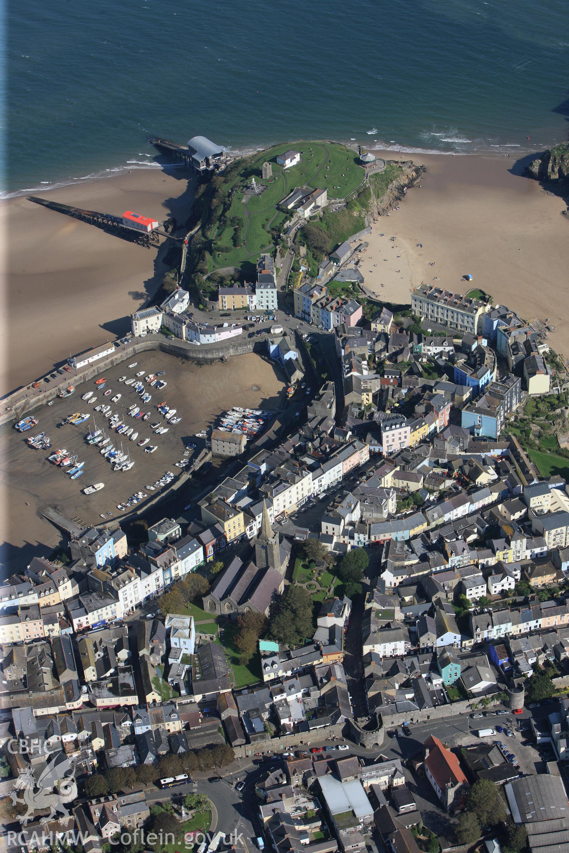 RCAHMW colour oblique photograph of Tenby, looking towards the town wall, St Mary's Church and the harbour. Taken by Toby Driver and Oliver Davies on 28/09/2011.