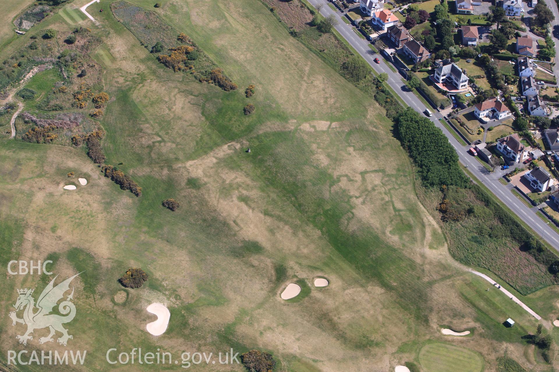 RCAHMW colour oblique photograph of Maesdu Golf Course, with parchmarks of WWI practice trenches. Taken by Toby Driver on 03/05/2011.