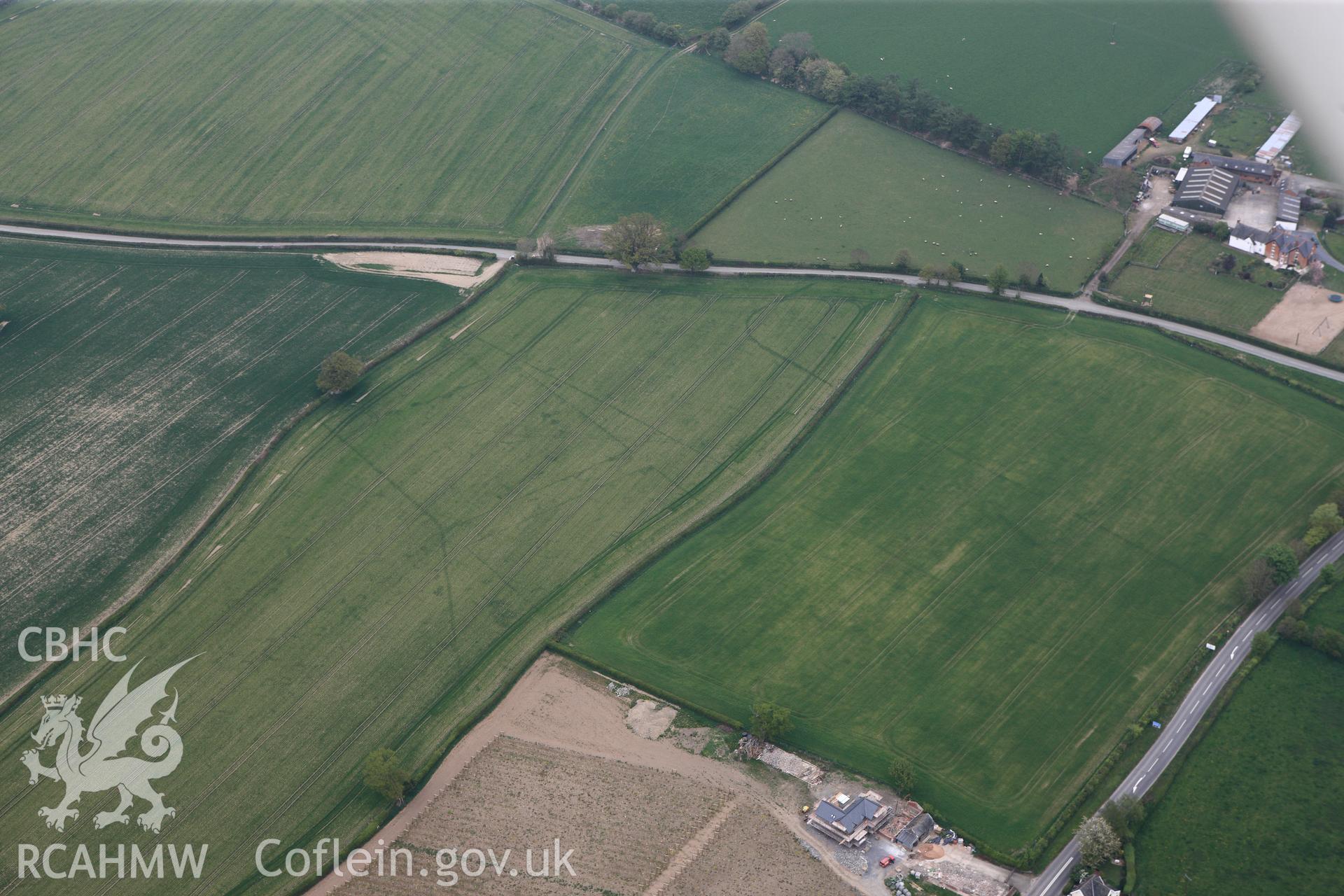 RCAHMW colour oblique photograph of Brompton or Pentrehyling Roman marching camps. Taken by Toby Driver on 26/04/2011.