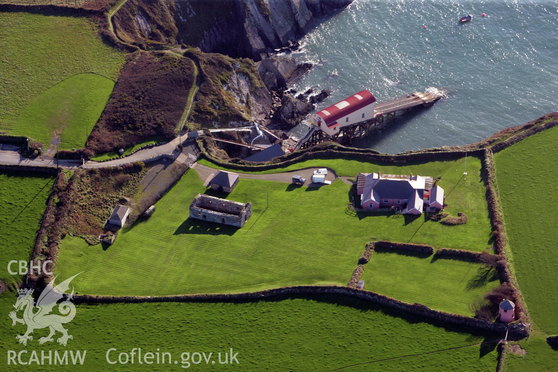 RCAHMW colour oblique photograph of St Justinian's Chapel, St Justnina's Bungalow and St Davids lifeboat station. Taken by O. Davies & T. Driver on 22/11/2013.