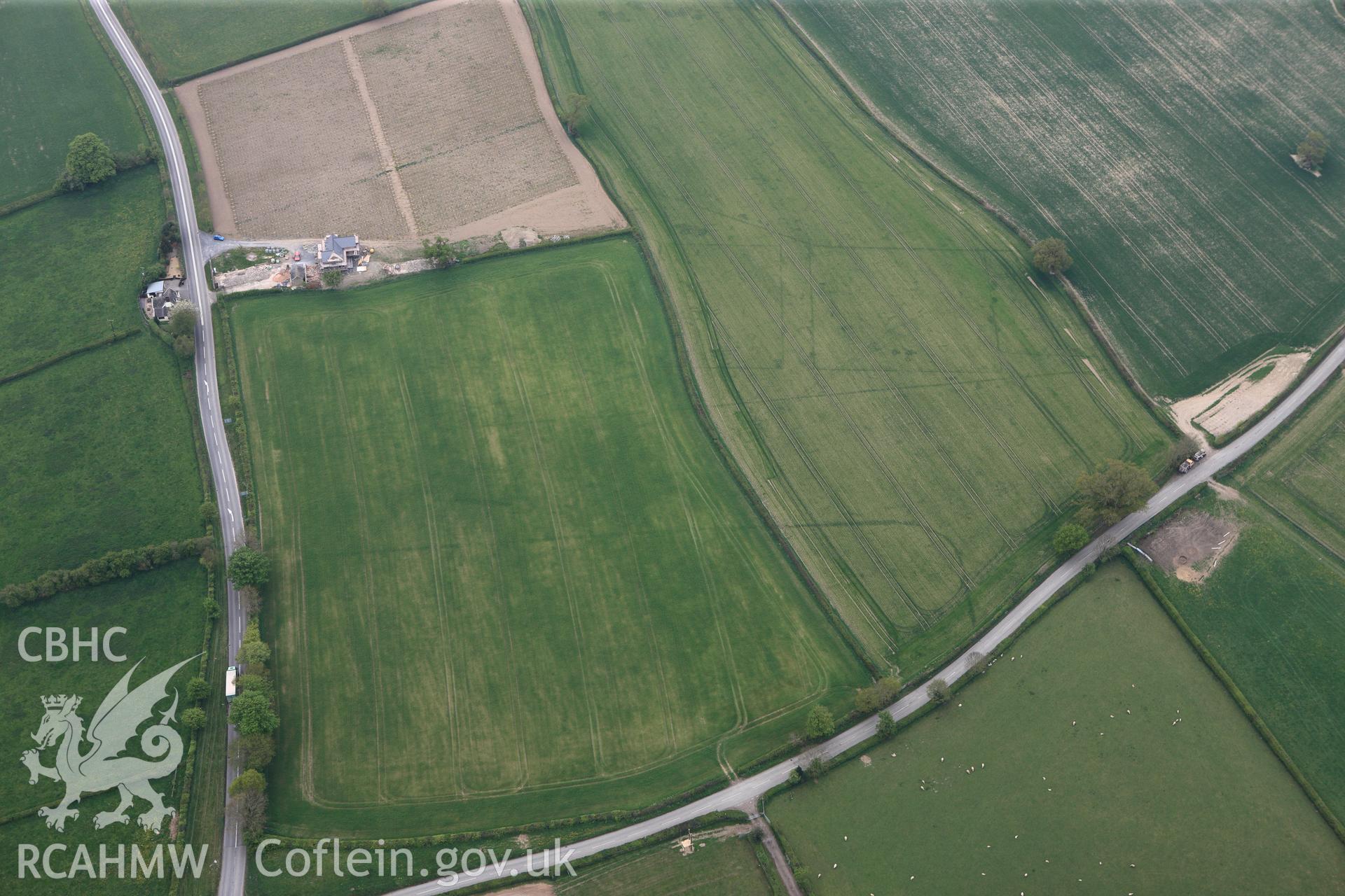 RCAHMW colour oblique photograph of Brompton or Pentrehyling Roman marching camps. Taken by Toby Driver on 26/04/2011.