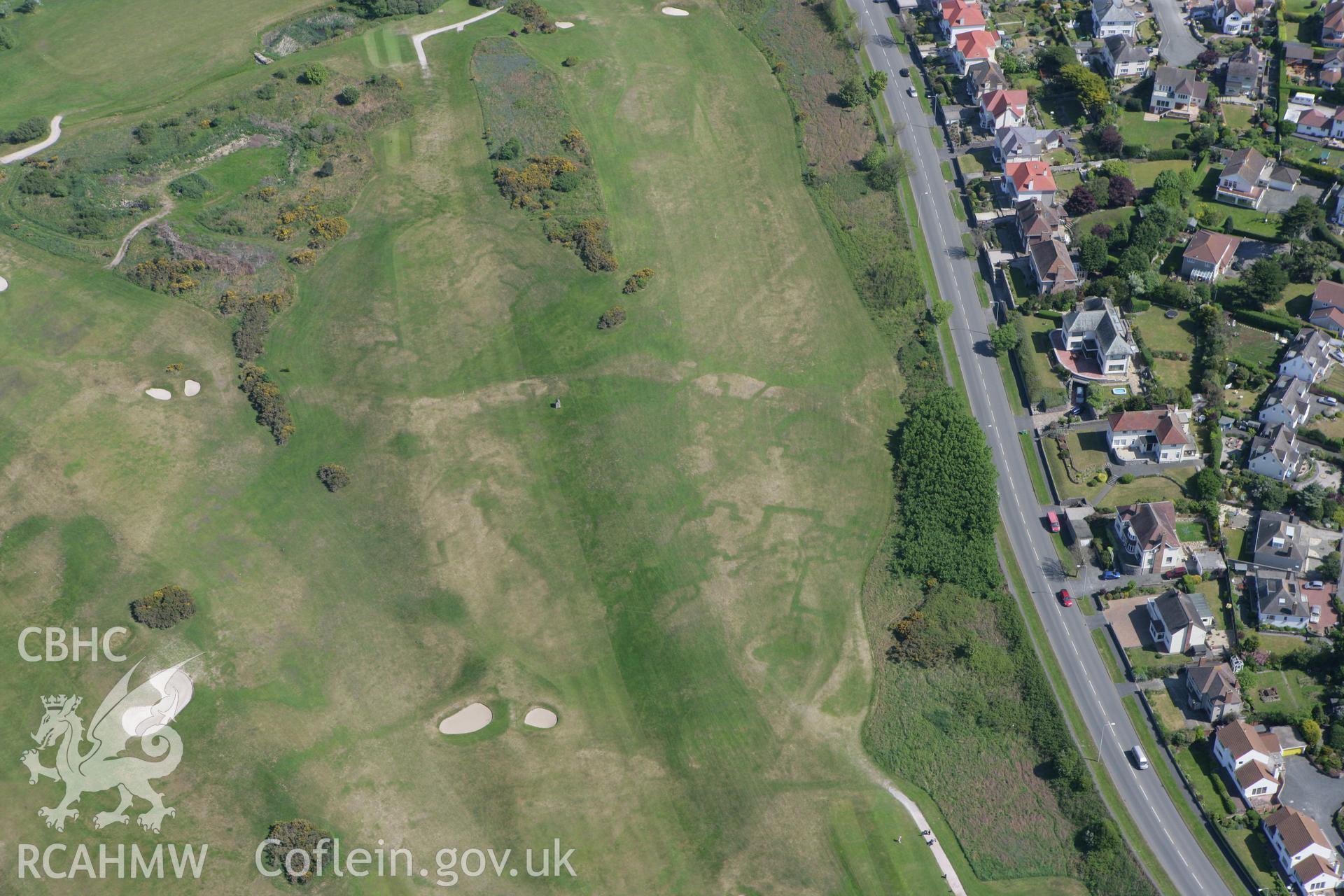 RCAHMW colour oblique photograph of Maesdu Golf Course, with parchmarks of WWI practice trenches. Taken by Toby Driver on 03/05/2011.