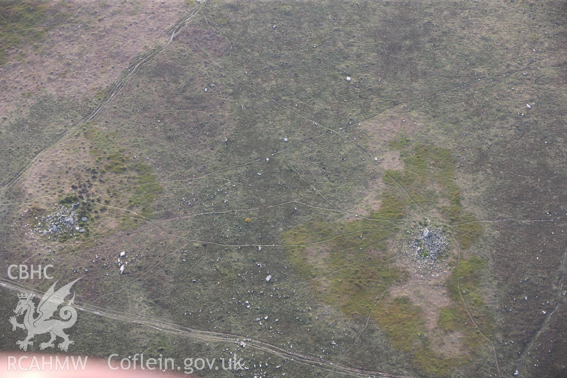 RCAHMW colour oblique photograph of Sweyne's Howe south cairn. Taken by Toby Driver and Oliver Davies on 04/05/2011.