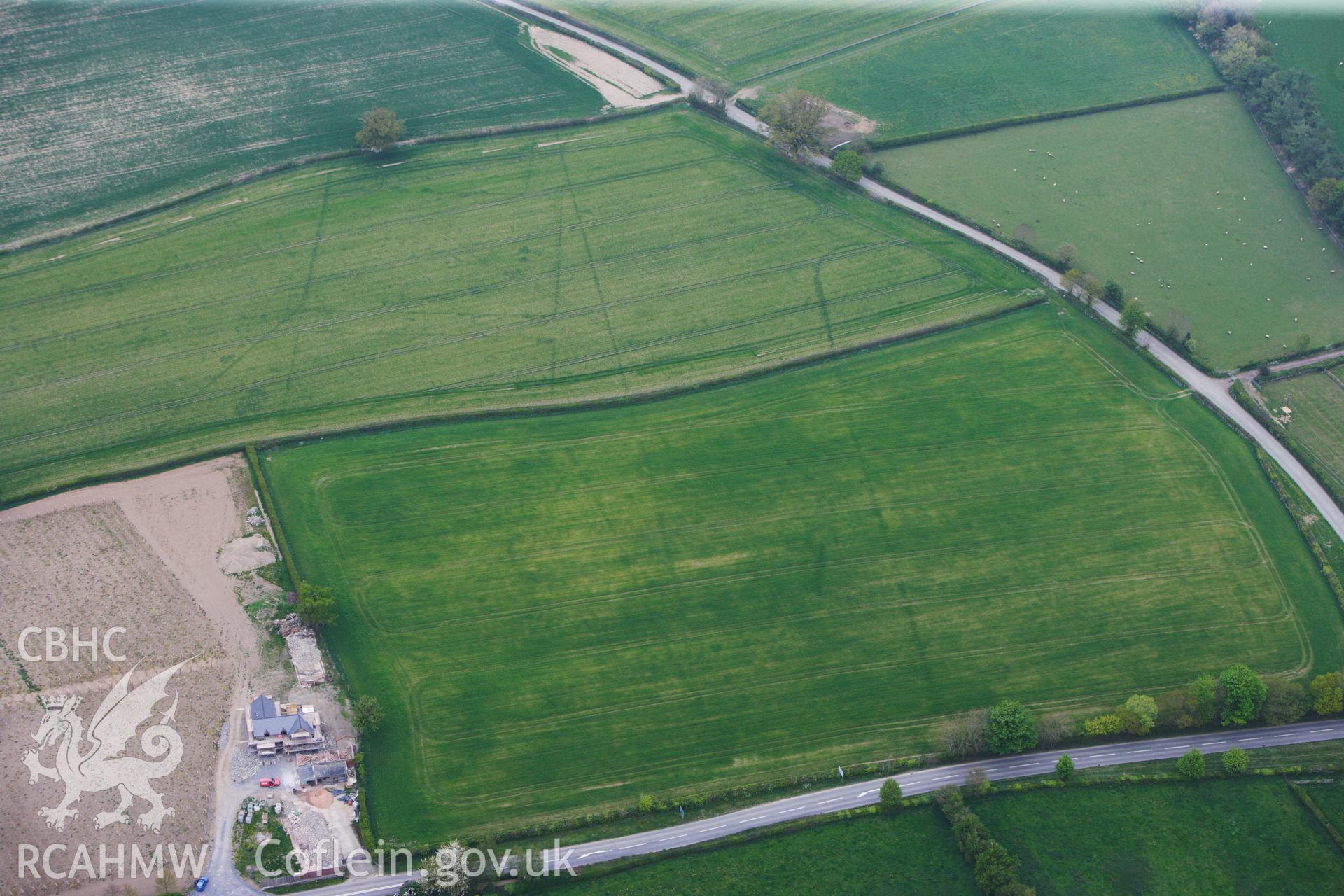 RCAHMW colour oblique photograph of Brompton or Pentrehyling Roman marching camps. Taken by Toby Driver on 26/04/2011.