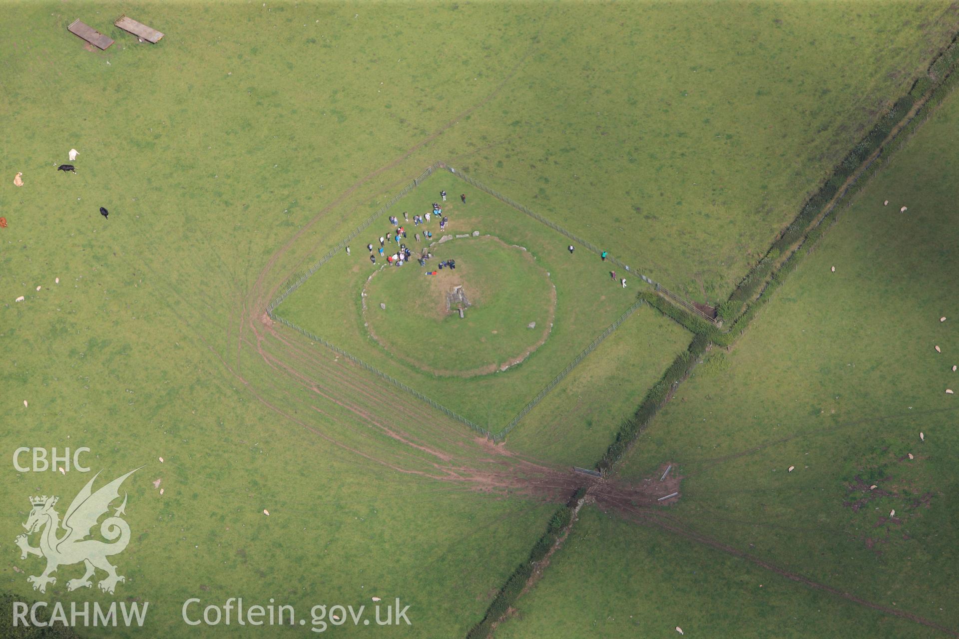 RCAHMW colour oblique photograph of Bryn Celli Ddu, chambered tomb, with public tour. Taken by Toby Driver on 20/07/2011.