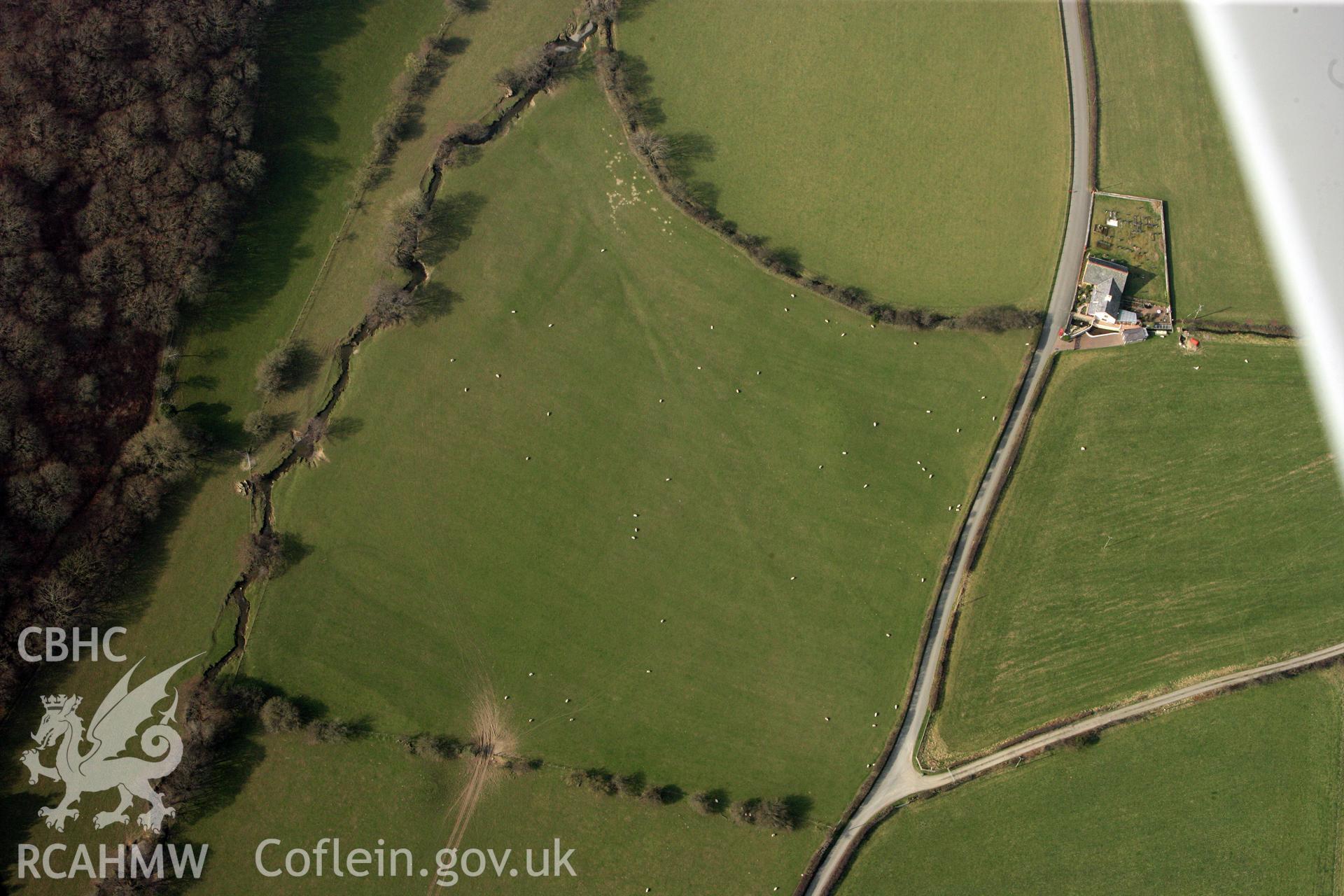 RCAHMW colour oblique photograph of Dyffryn Gwyn, Tumulus. Taken by Toby Driver on 25/03/2011.