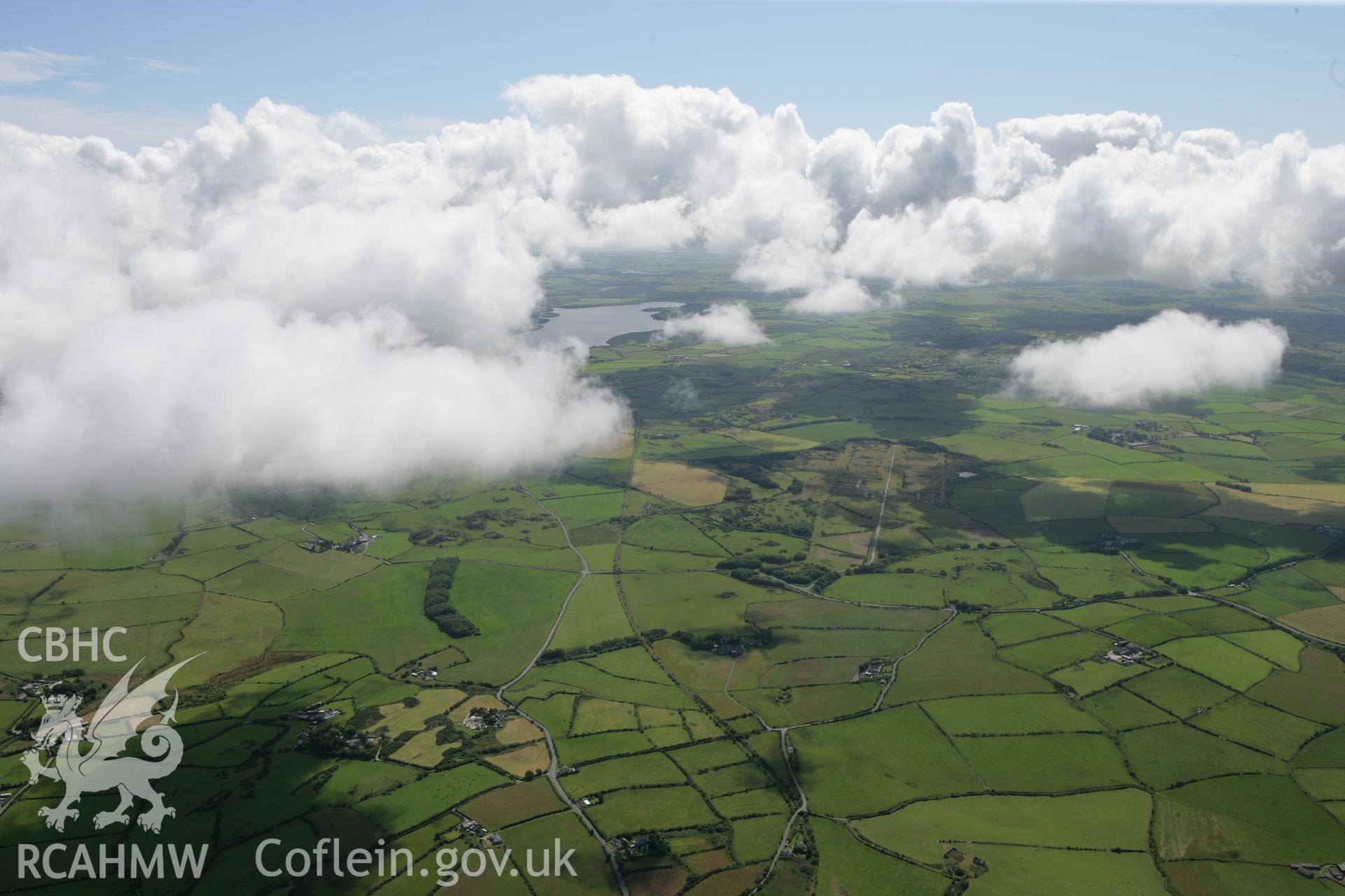 RCAHMW colour oblique photograph of Landscape of central Anglesey from north-east, towards Llyn Alaw. Taken by Toby Driver on 20/07/2011.