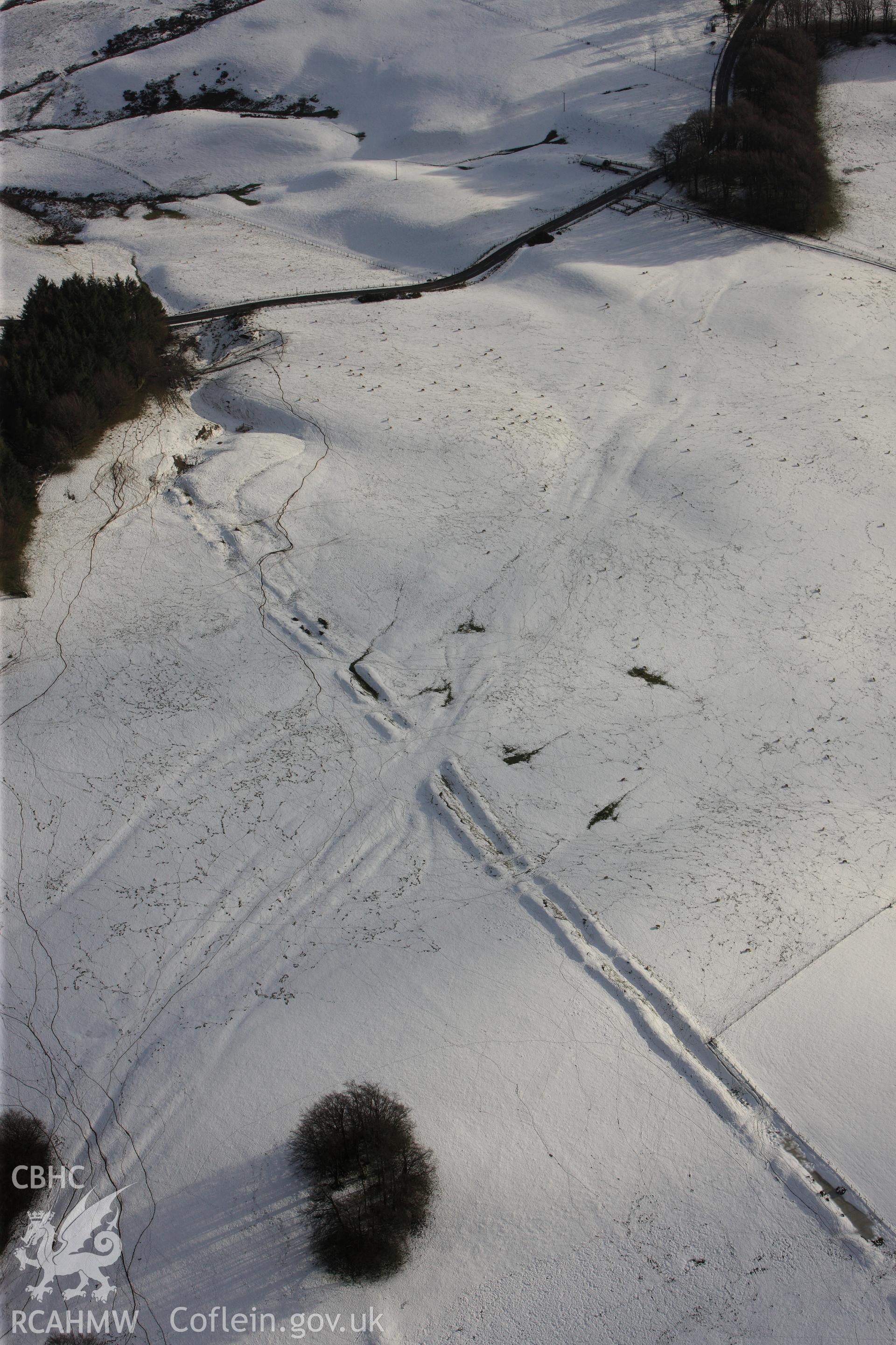 RCAHMW colour oblique photograph of Crugyn Bank, under snow. Taken by Toby Driver on 18/12/2011.