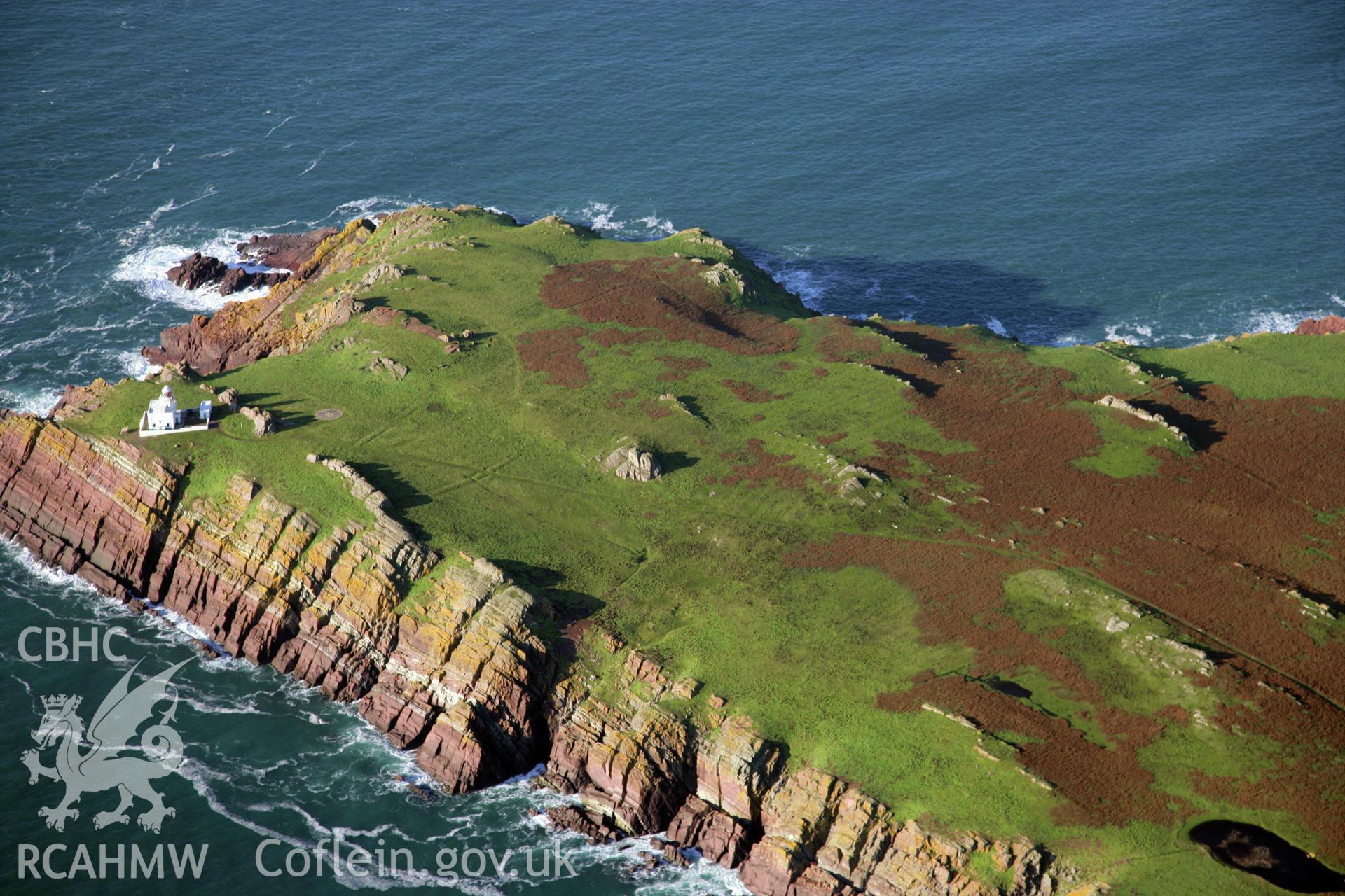 RCAHMW colour oblique photograph of Skokholm Island and lighthouse, viewed from the south. Taken by O. Davies & T. Driver on 22/11/2013.