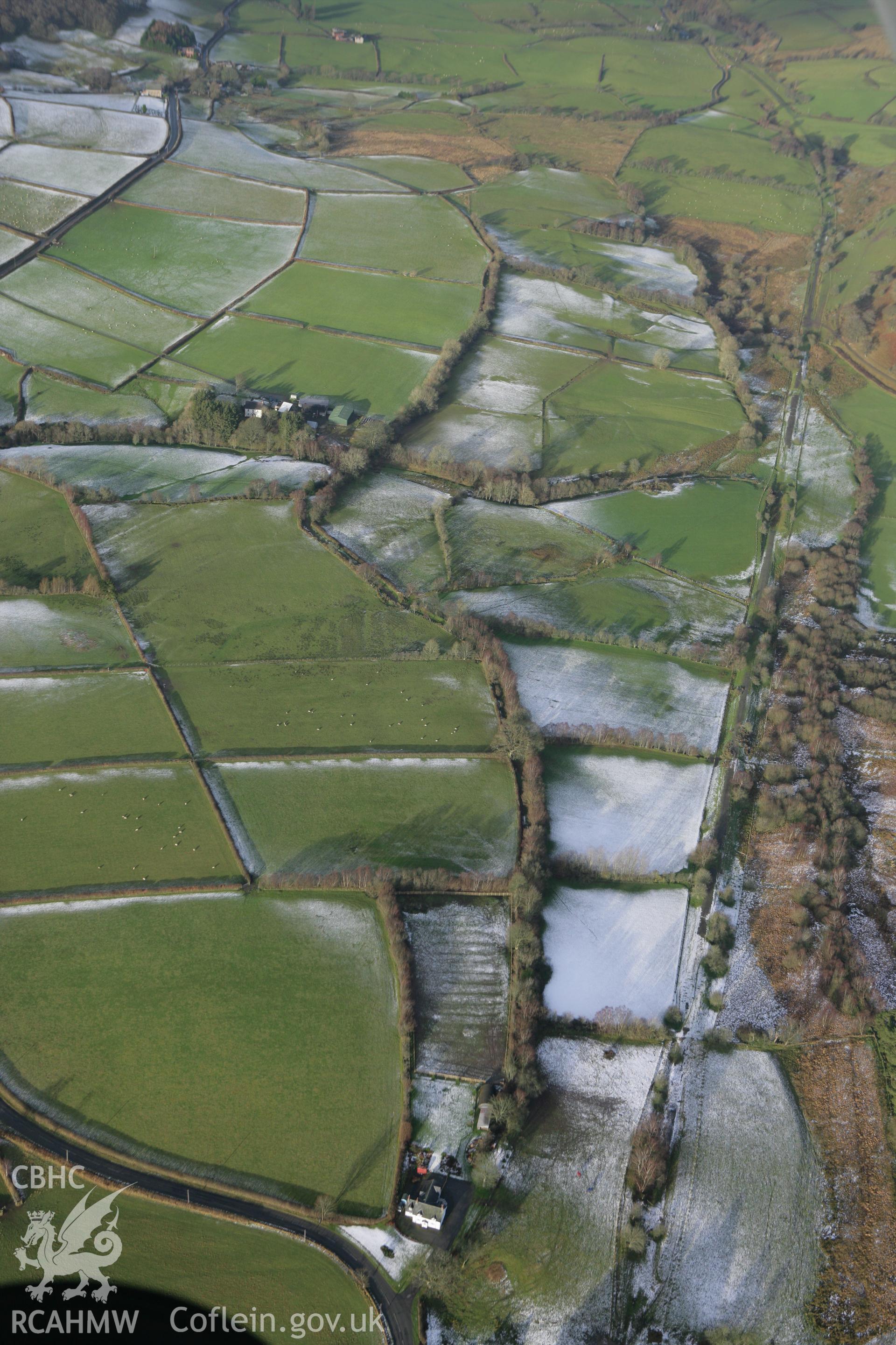 RCAHMW colour oblique photograph of Llwyn-y-brain, line of Roman road, looking north. Taken by Toby Driver on 18/12/2011.