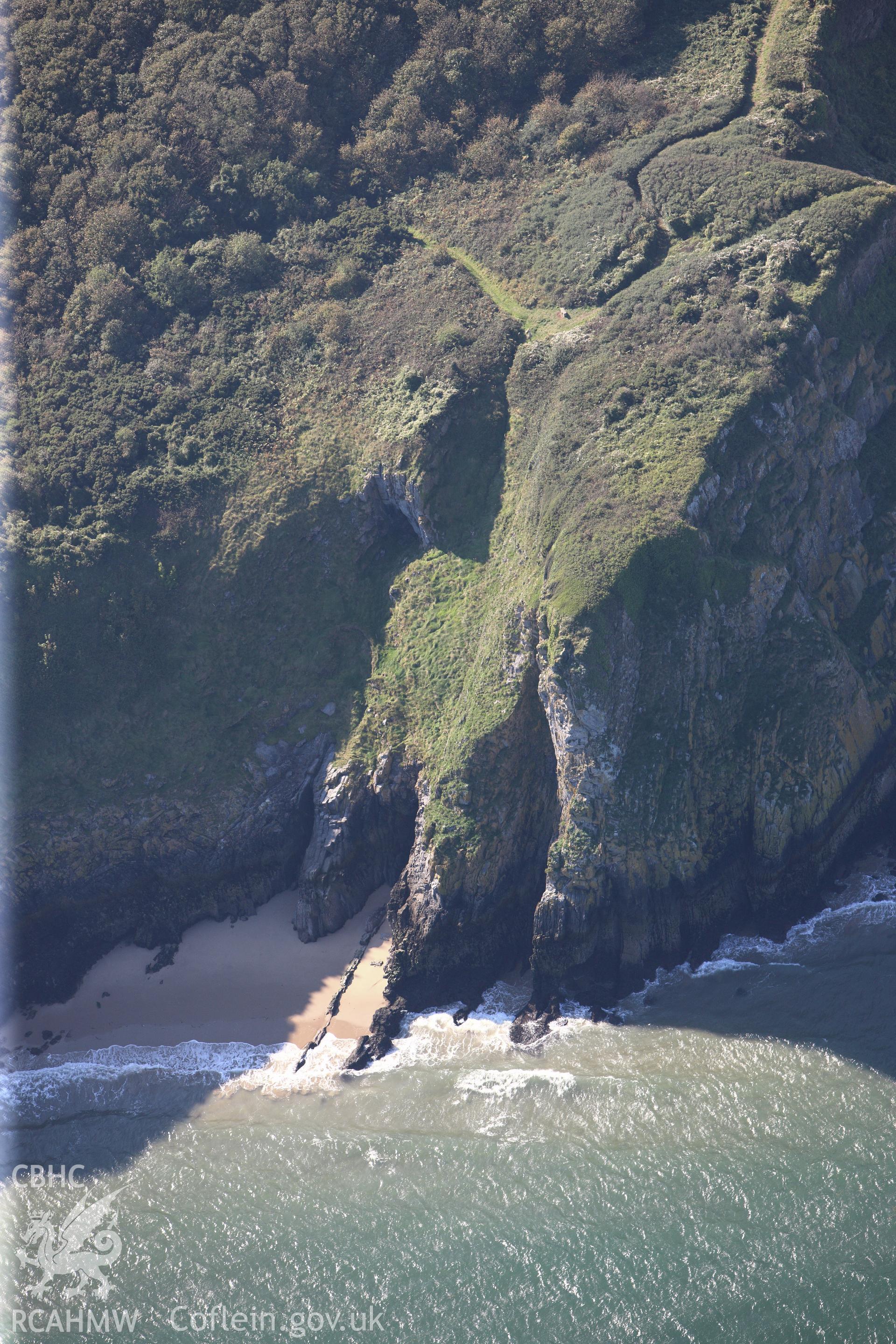 RCAHMW colour oblique photograph of Nanna's Cave, Caldey Point. Taken by Toby Driver and Oliver Davies on 28/09/2011.