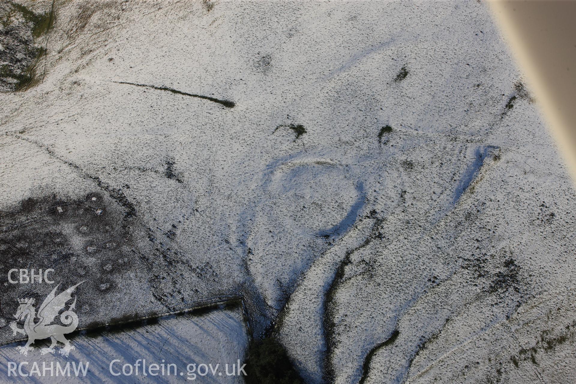 RCAHMW colour oblique photograph of Hill Tenement defended enclosure. Taken by Toby Driver on 18/12/2011.