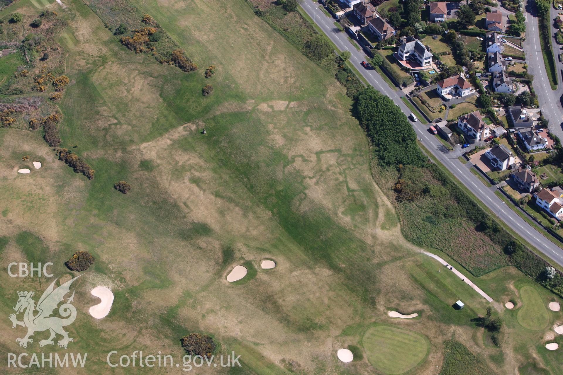 RCAHMW colour oblique photograph of Maesdu Golf Course, with parchmarks of WWI practice trenches. Taken by Toby Driver on 03/05/2011.