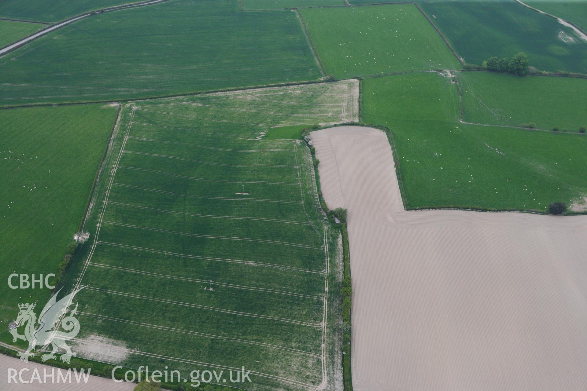 RCAHMW colour oblique photograph of Womaston Neolithic Causewayed enclosure. Taken by Toby Driver on 26/04/2011.