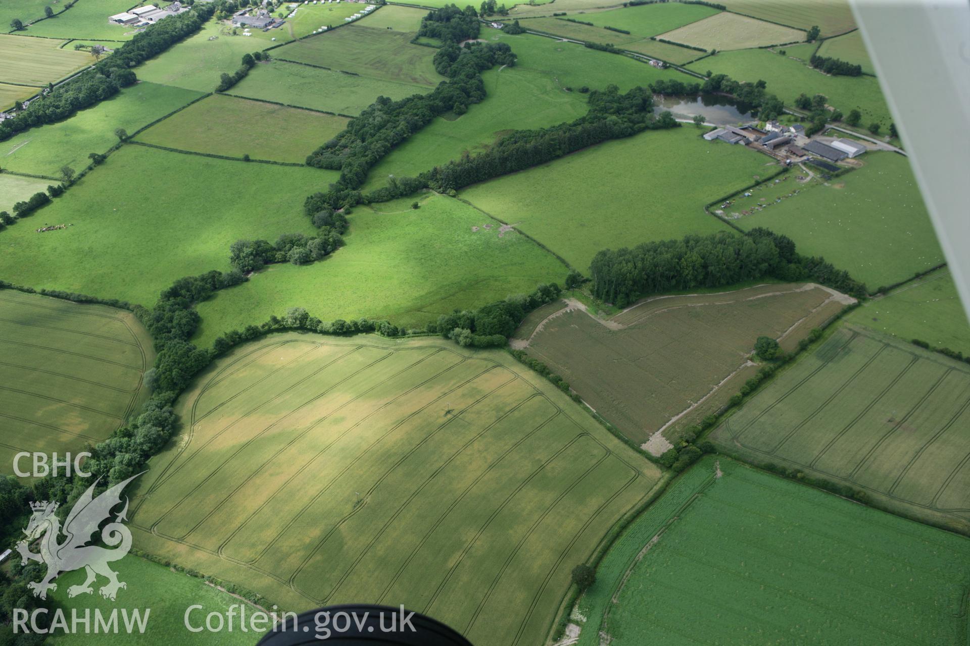 RCAHMW colour oblique photograph of Hindwell Roman fort, landscape view from east. Taken by Toby Driver on 20/07/2011.