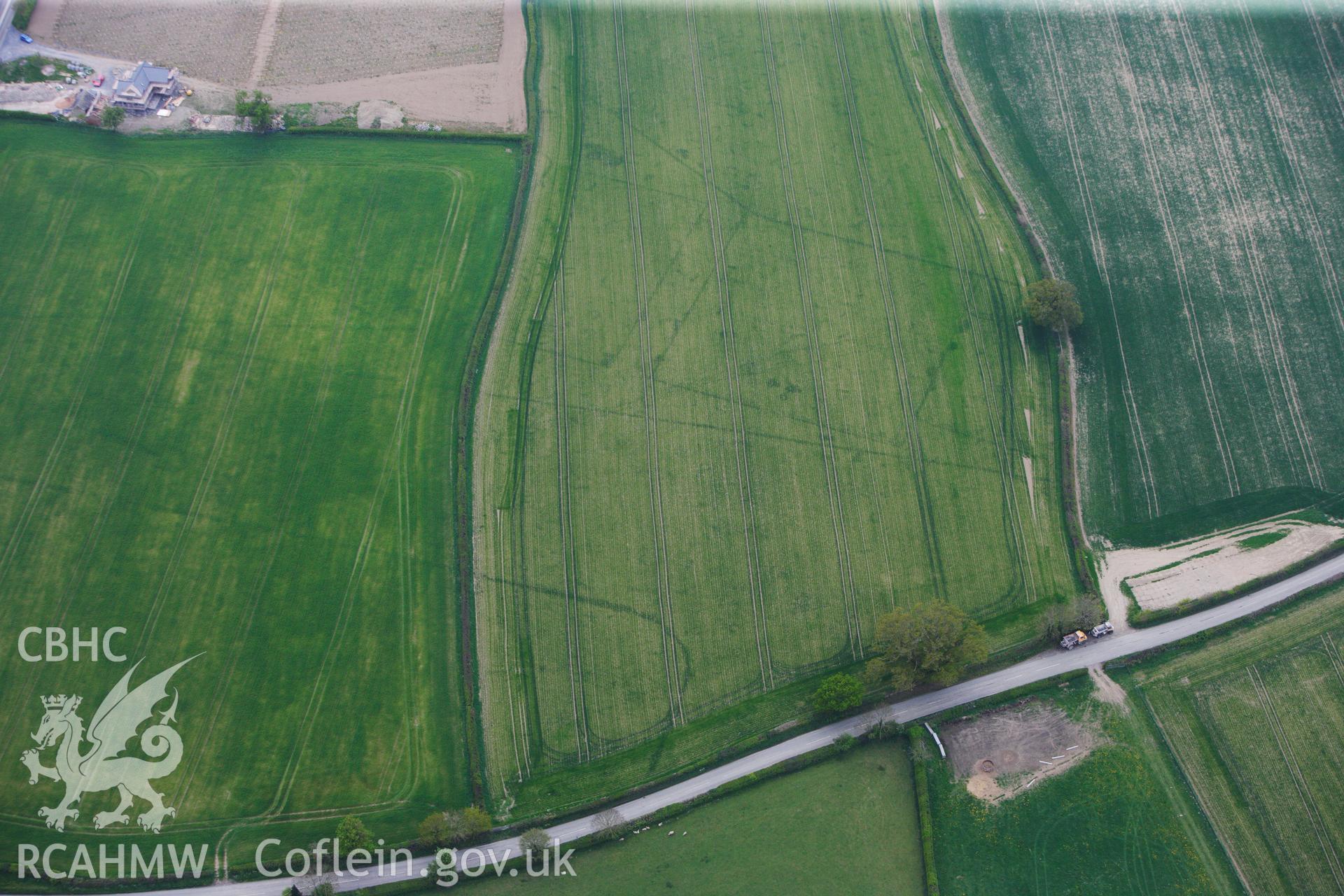 RCAHMW colour oblique photograph of Brompton or Pentrehyling Roman marching camps. Taken by Toby Driver on 26/04/2011.