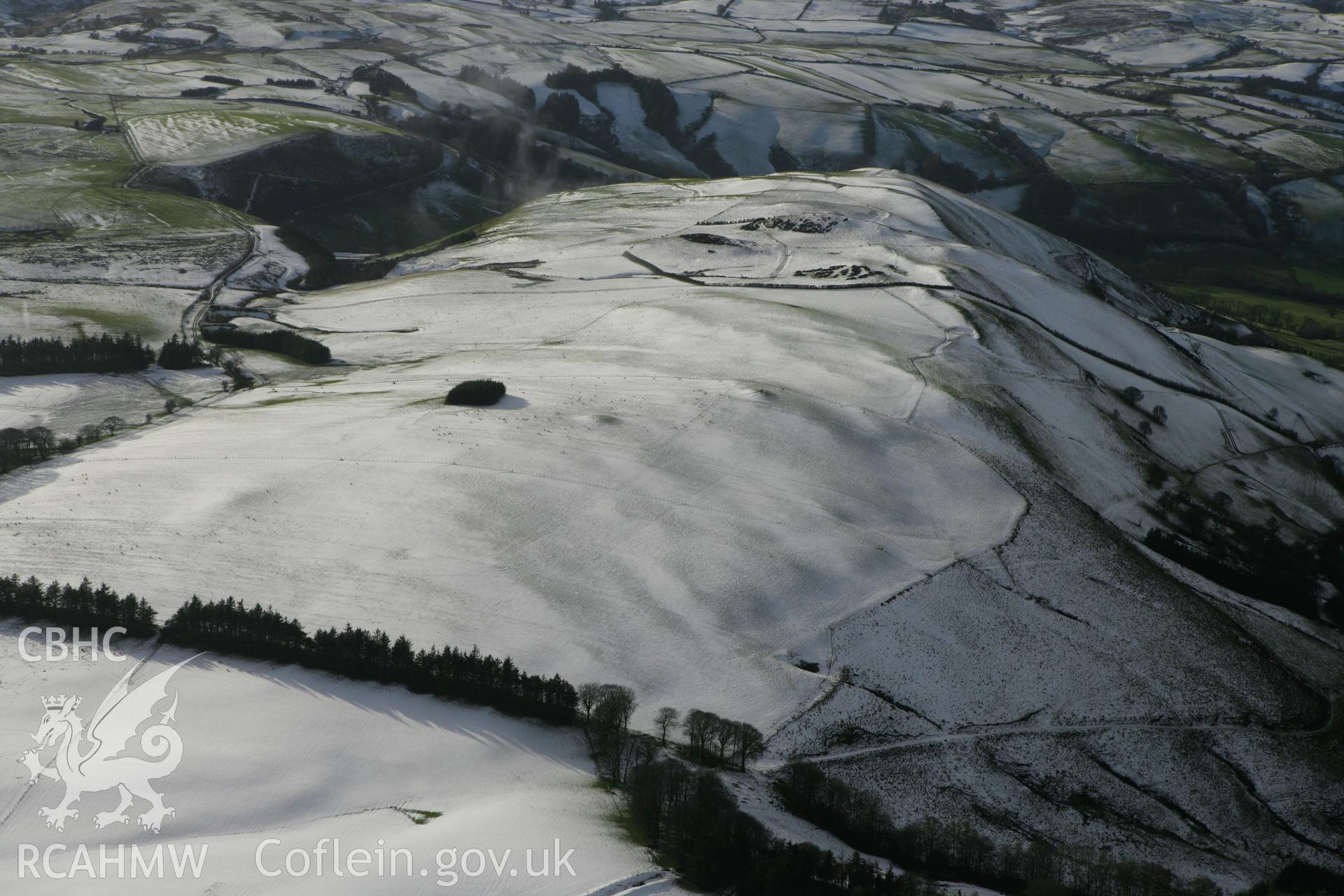 RCAHMW colour oblique photograph of Glog round barrows, from east. Taken by Toby Driver on 18/12/2011.