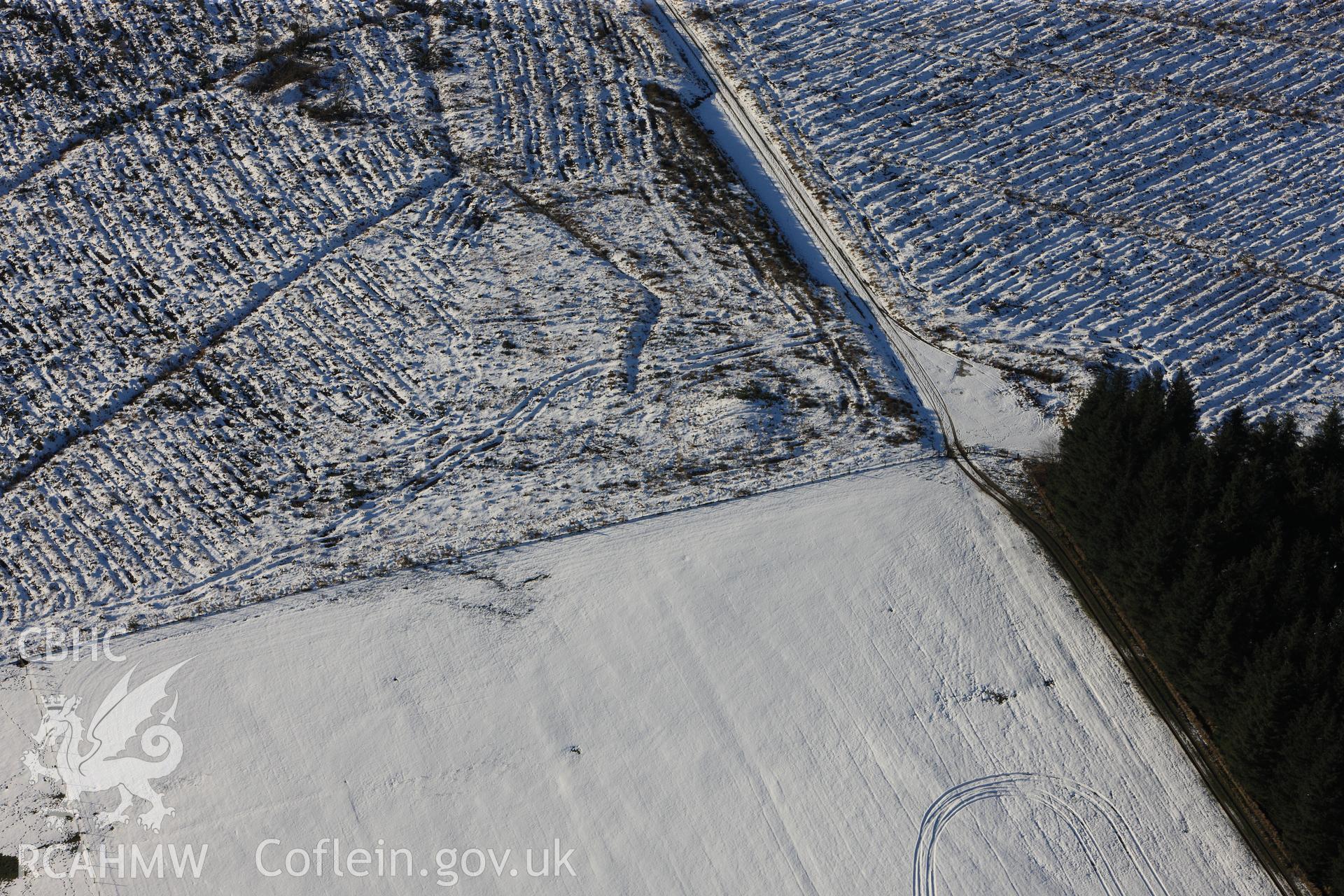 RCAHMW colour oblique photograph of Block Wood Barrow, under snow. Taken by Toby Driver on 18/12/2011.