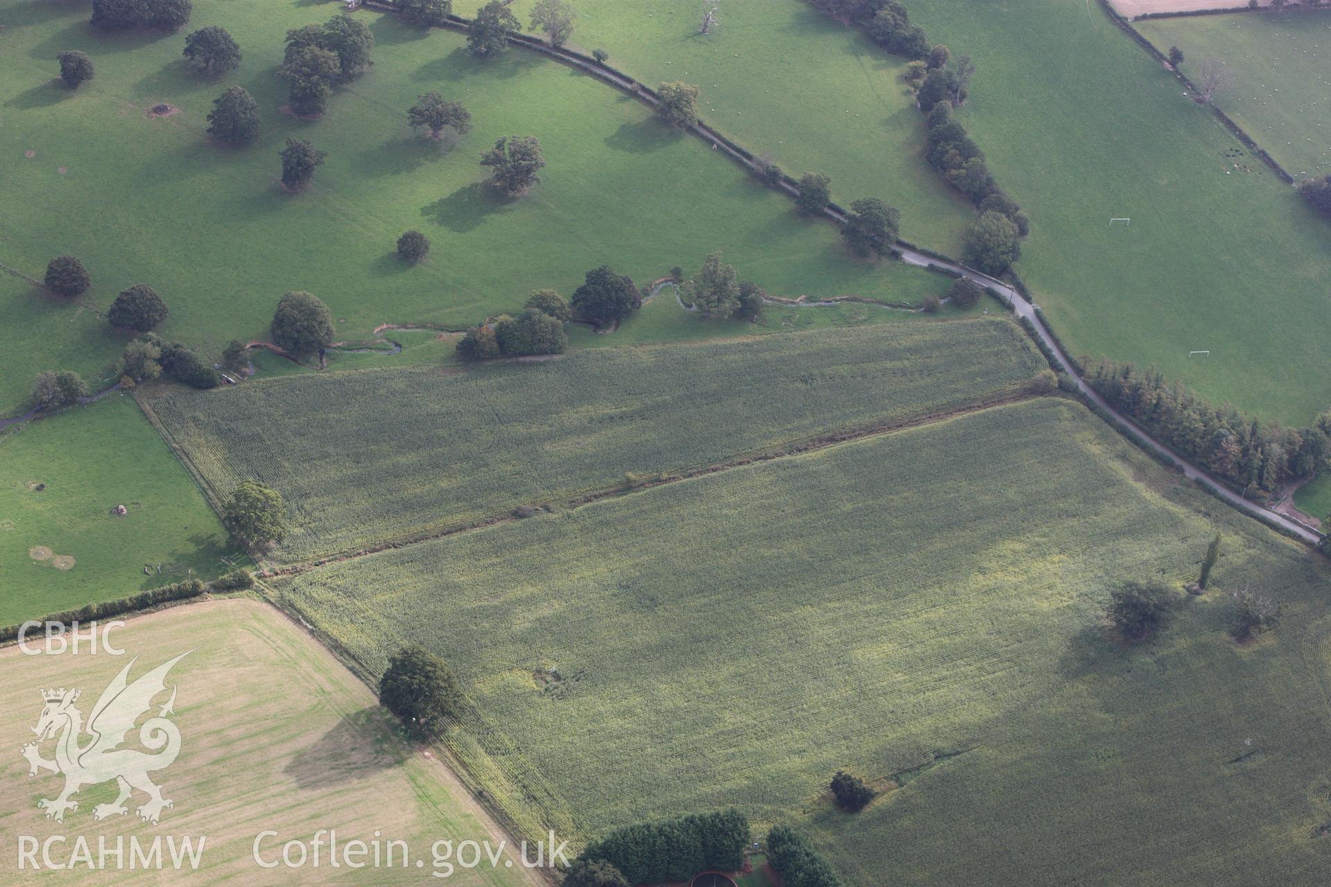 RCAHMW colour oblique photograph of Plas Newydd Romano-British Temple Cropwork; Plasnewydd Roman Temple. Taken by Toby Driver on 04/10/2011.