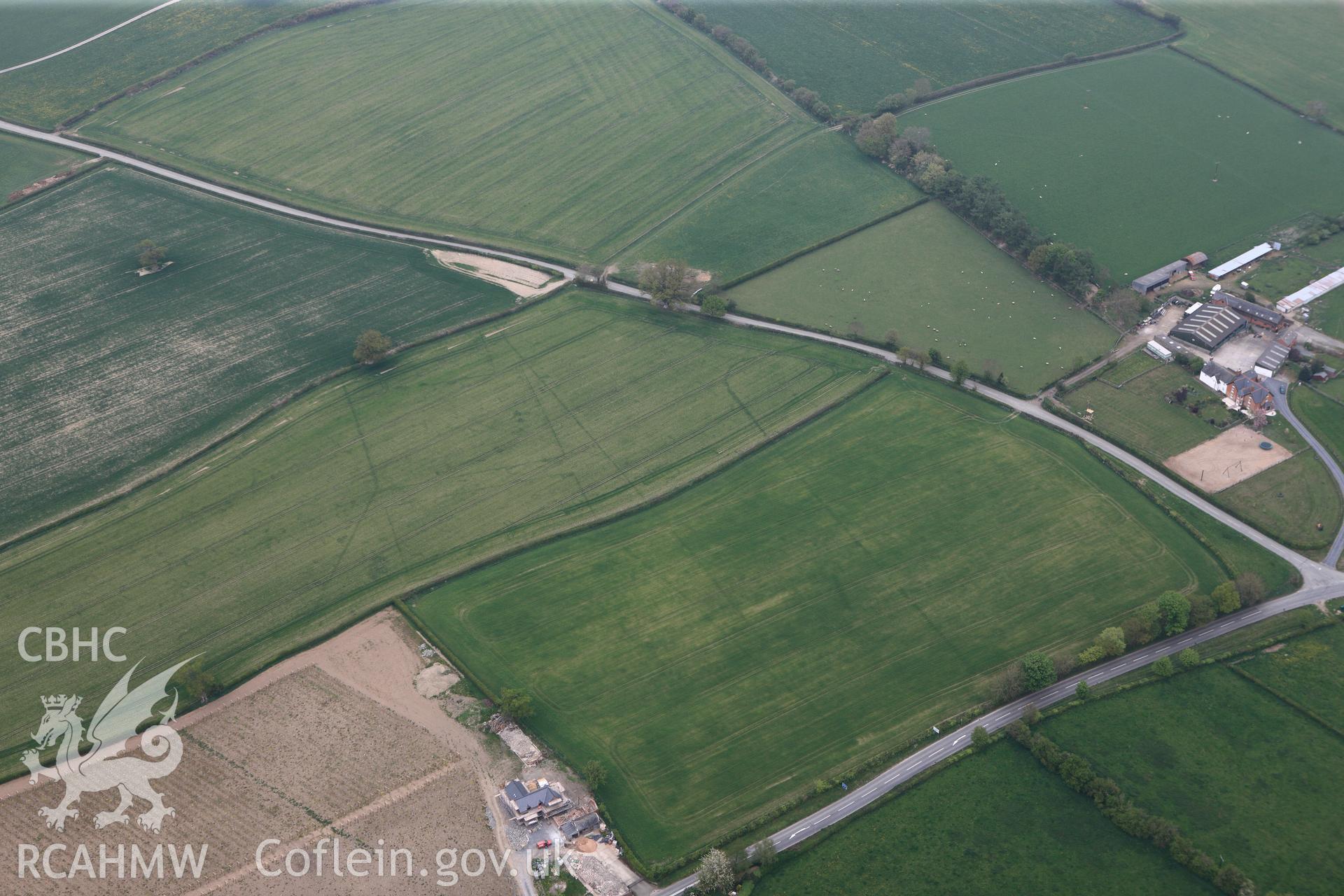 RCAHMW colour oblique photograph of Brompton or Pentrehyling Roman marching camps. Taken by Toby Driver on 26/04/2011.