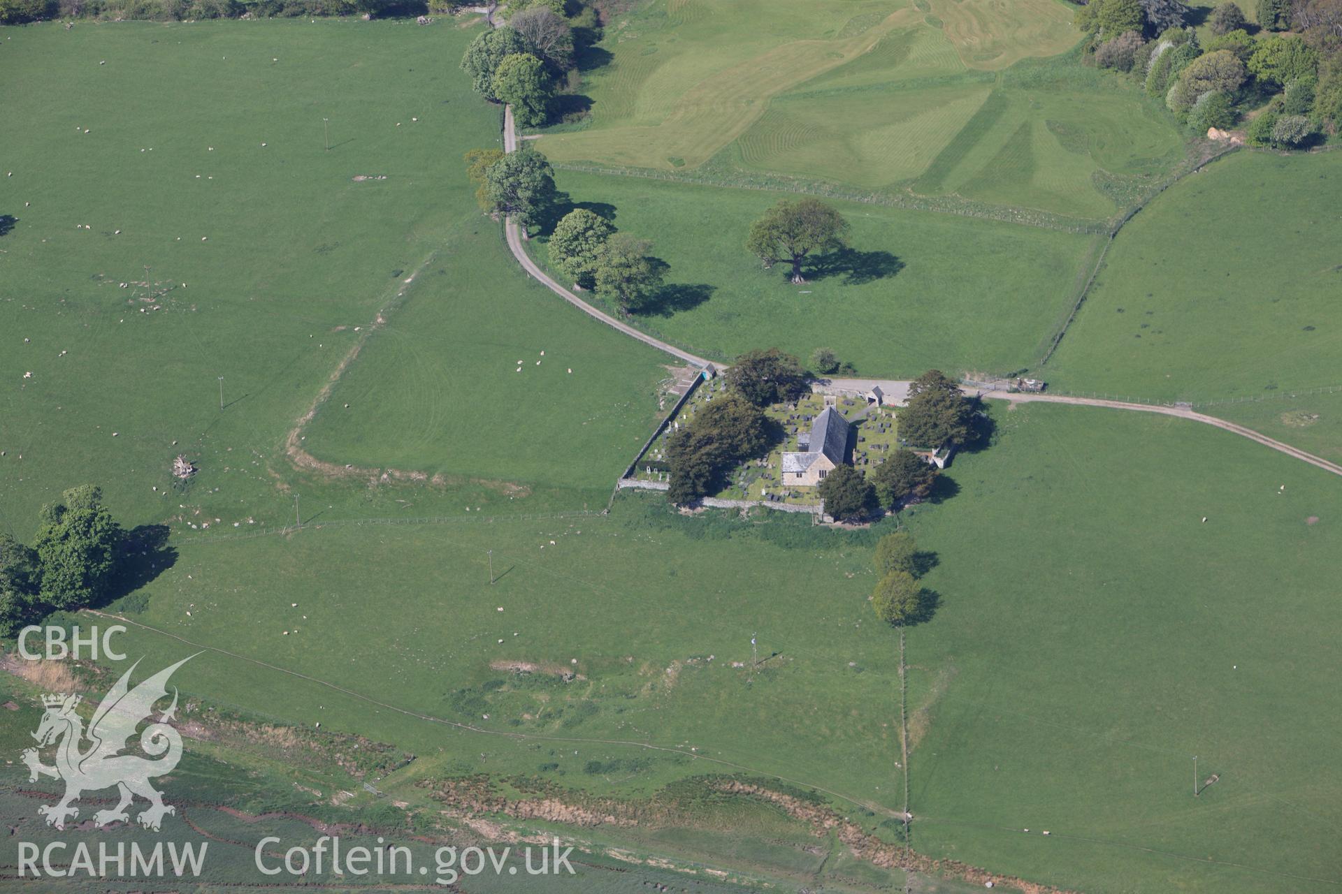 RCAHMW colour oblique photograph of Caerhun Roman Military Settlement, with St Mary's Church, Caerhun. Taken by Toby Driver on 03/05/2011.