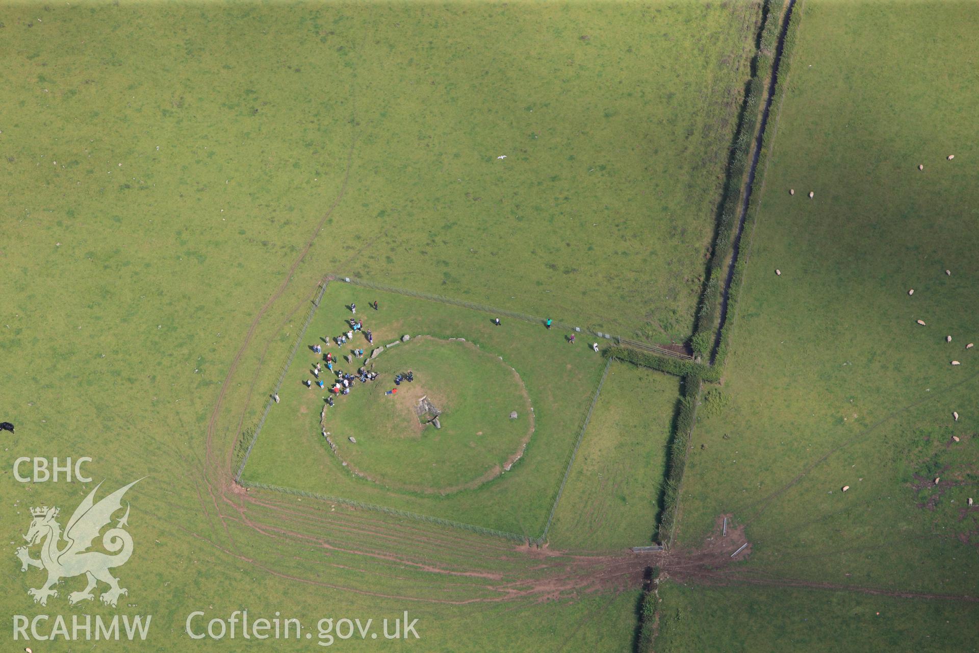 RCAHMW colour oblique photograph of Bryn Celli Ddu, chambered tomb, with public tour. Taken by Toby Driver on 20/07/2011.