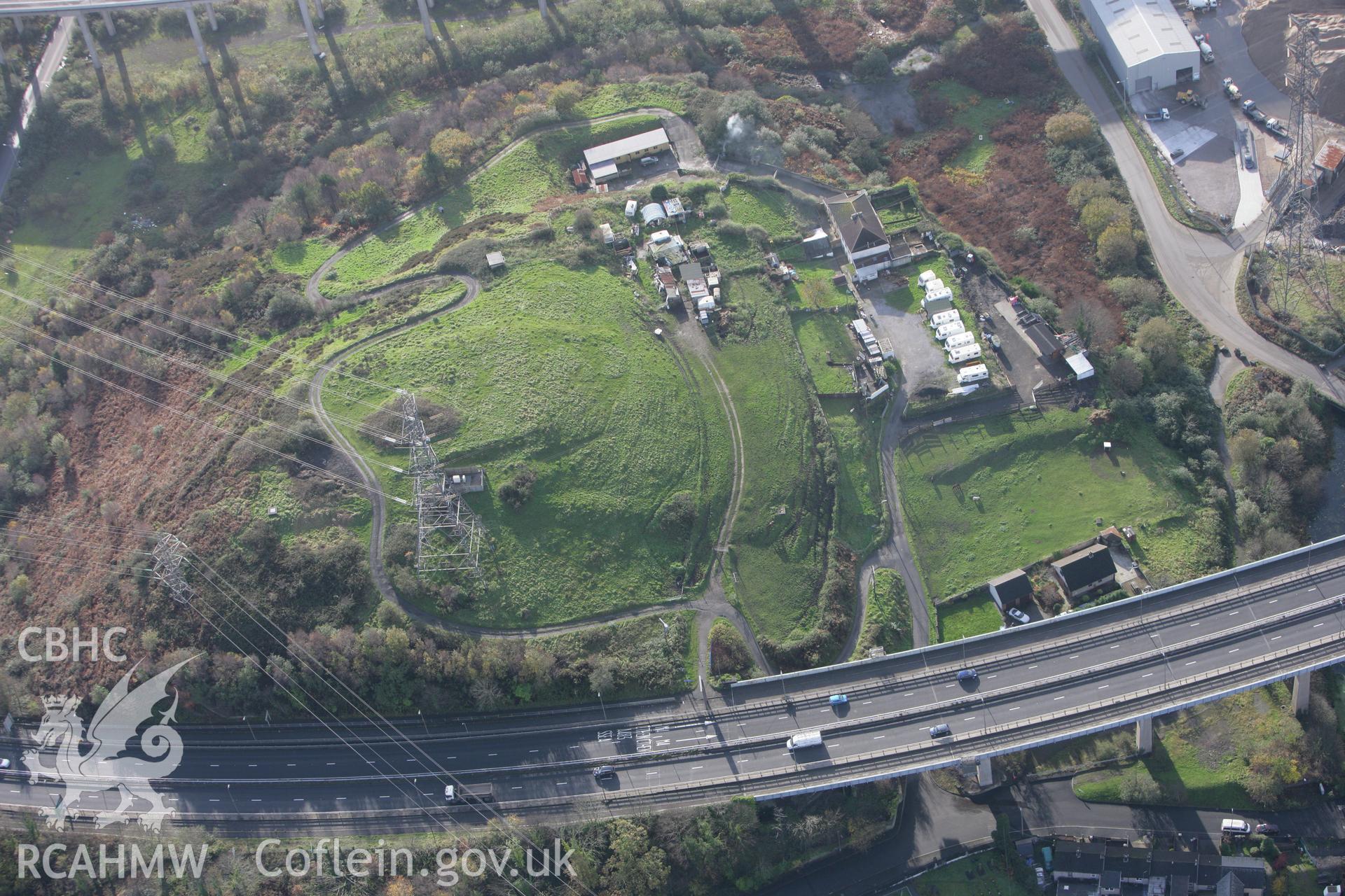 RCAHMW colour oblique photograph of Warren Hill enclosure. Taken by Toby Driver on 17/11/2011.