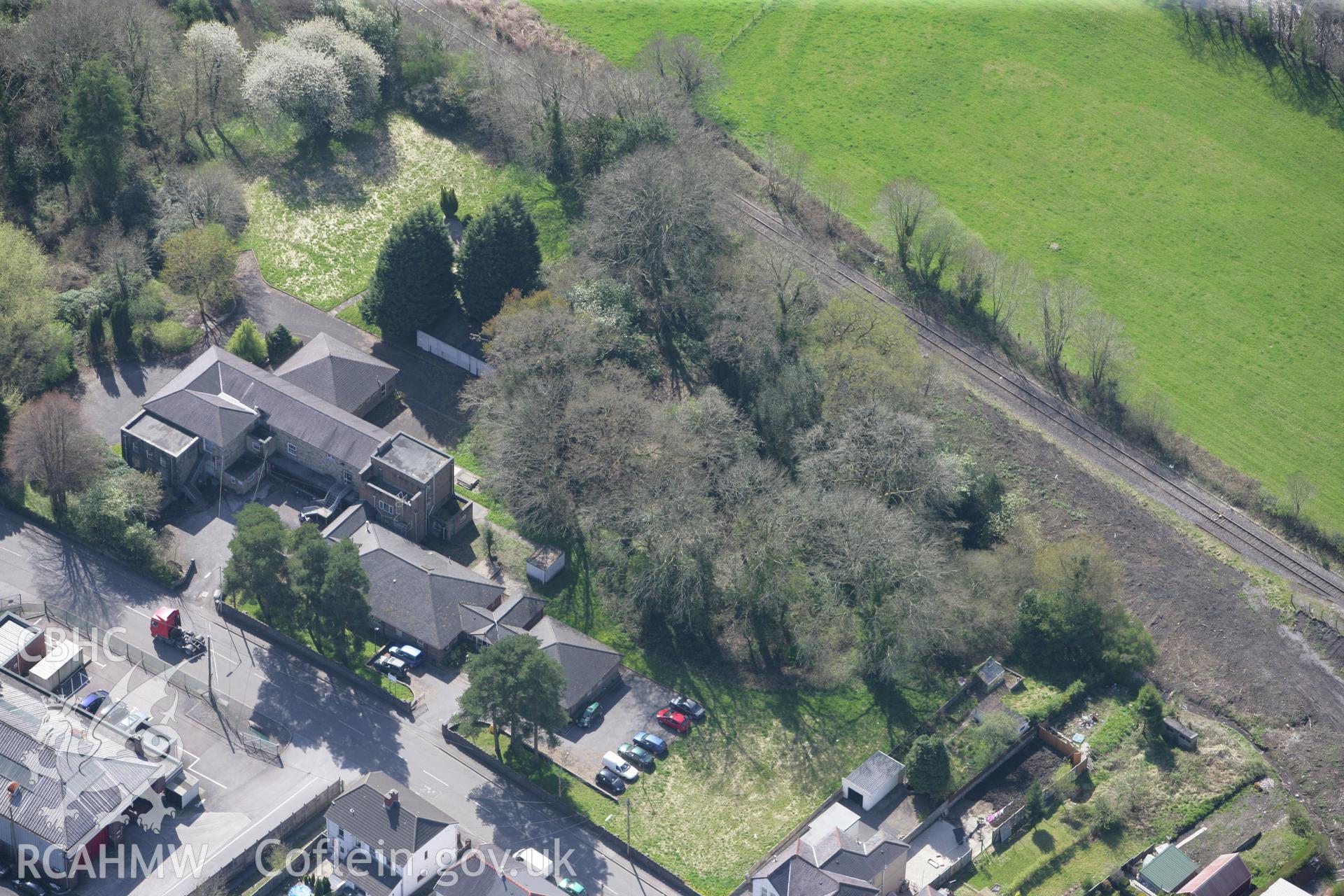 RCAHMW colour oblique photograph of Tir-y-Dail Motte and Bailey, Ammanford. Taken by Toby Driver on 08/04/2011.