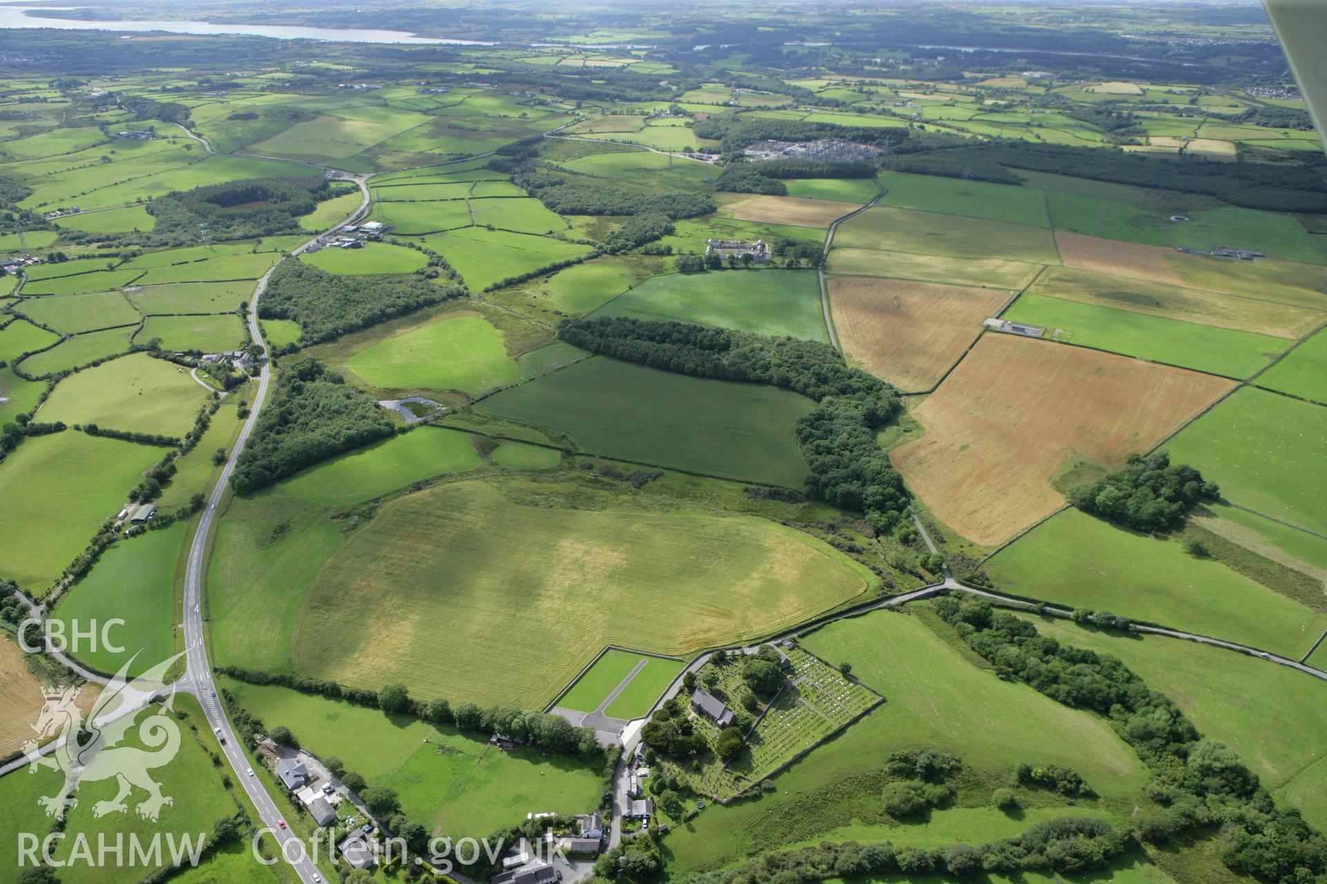 RCAHMW colour oblique photograph of St Cedol's Church, cropmarks (non-archaeological) to south-west of. Taken by Toby Driver on 20/07/2011.