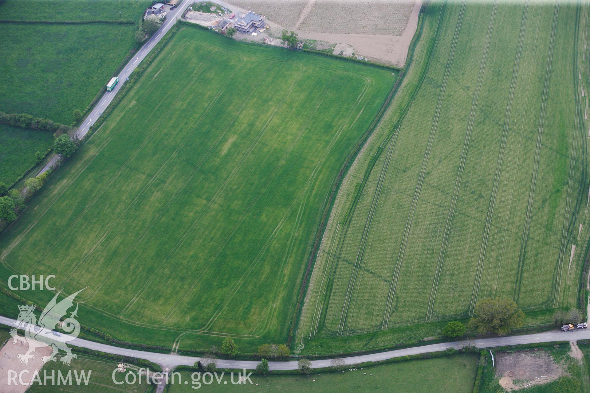 RCAHMW colour oblique photograph of Brompton or Pentrehyling Roman marching camps. Taken by Toby Driver on 26/04/2011.