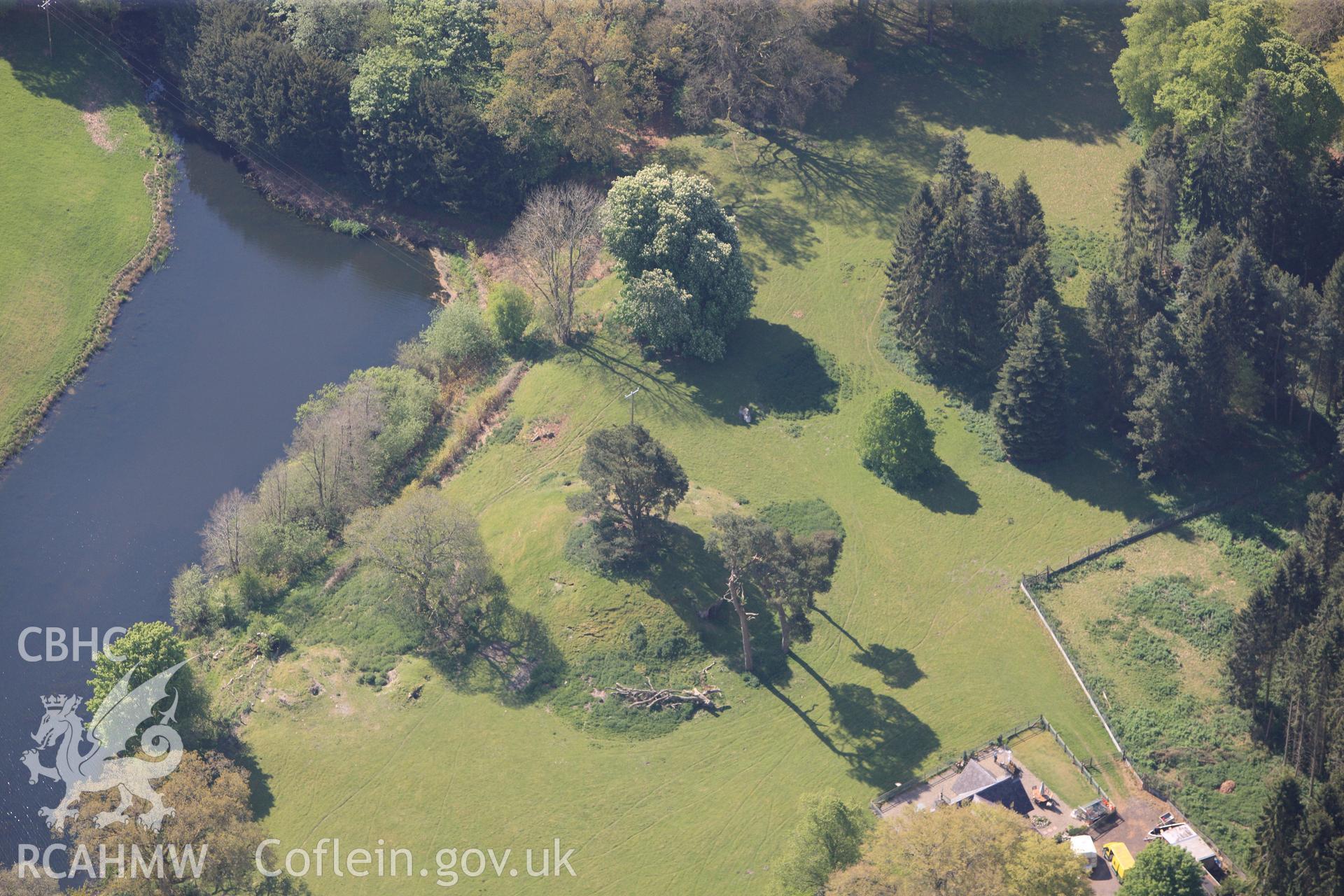 RCAHMW colour oblique photograph of Rug Castle Mound and Prehistoric Funerary Monument. Taken by Toby Driver on 03/05/2011.