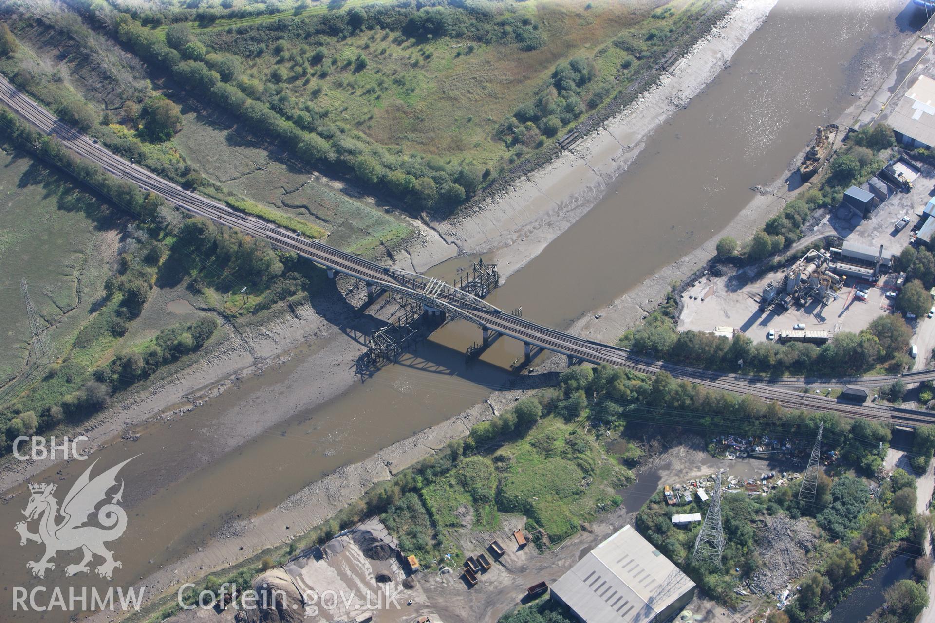 RCAHMW colour oblique photograph of railway swing bridge over the River Neath, between Coedffranc and Briton Ferry. Taken by Toby Driver and Oliver Davies on 28/09/2011.