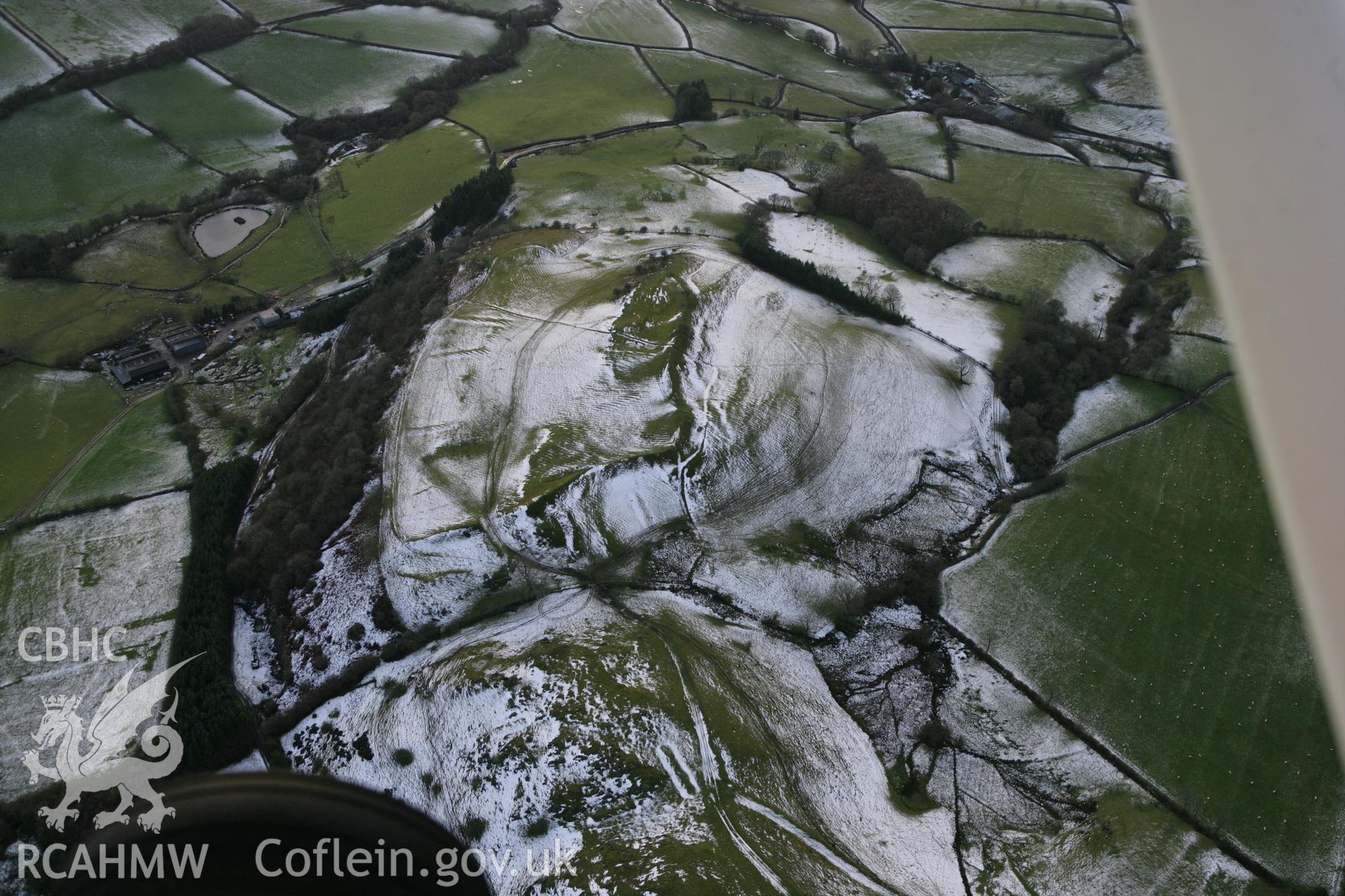 RCAHMW colour oblique photograph of Graig Fawr camp, hillfort. Taken by Toby Driver on 18/12/2011.