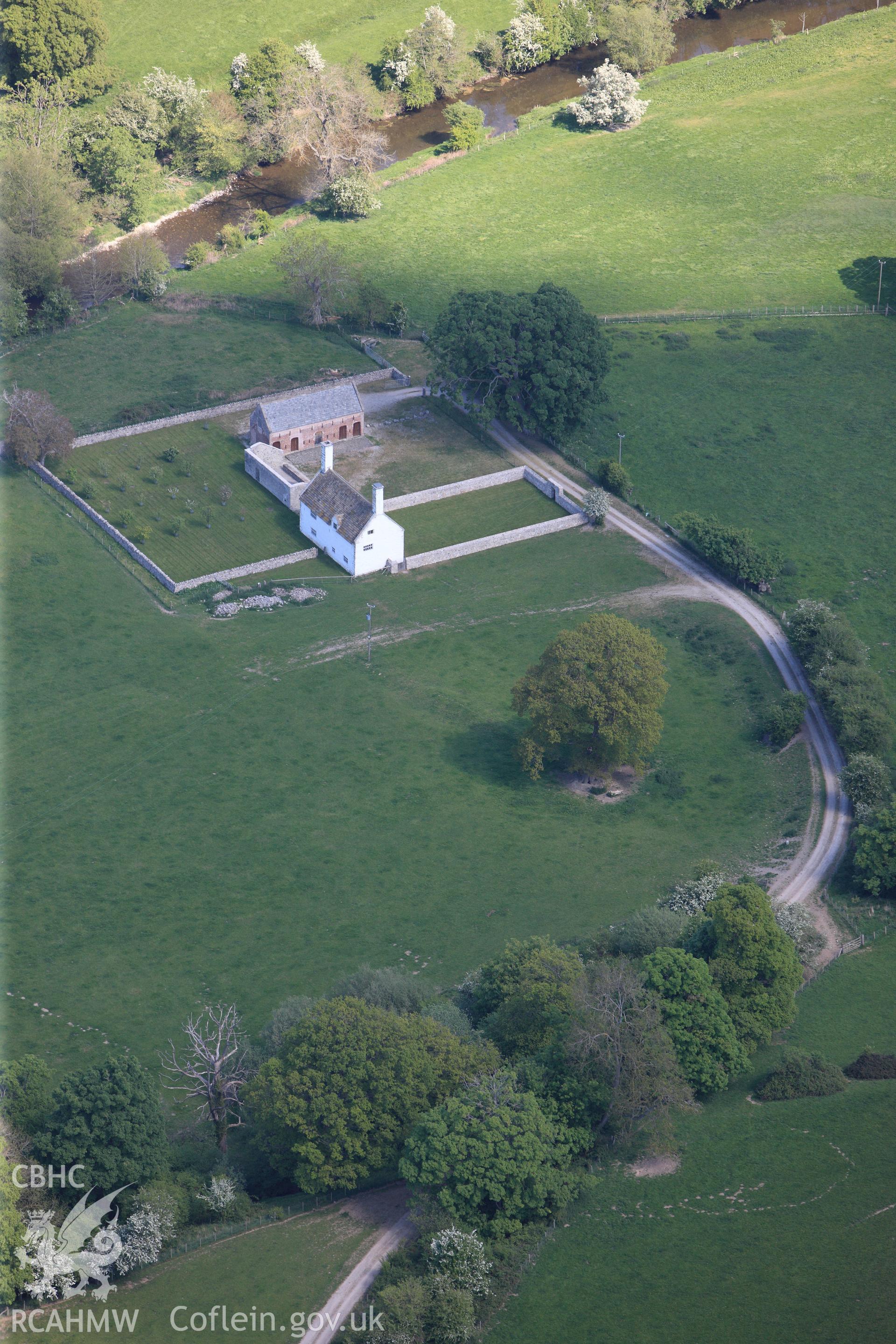 RCAHMW colour oblique photograph of Dolbelydir, house and barn. Taken by Toby Driver on 03/05/2011.