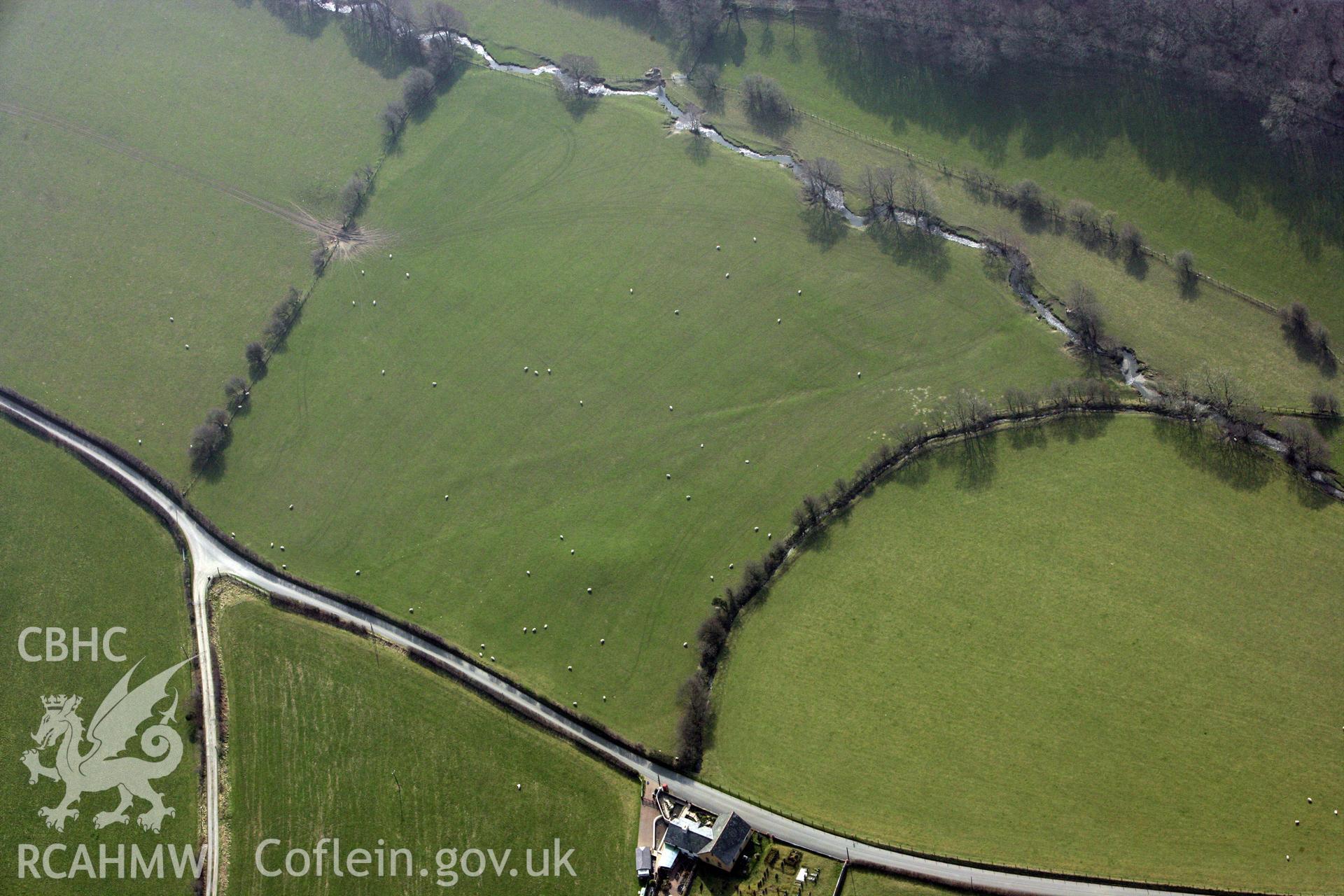 RCAHMW colour oblique photograph of Dyffryn Gwyn, Tumulus. Taken by Toby Driver on 25/03/2011.