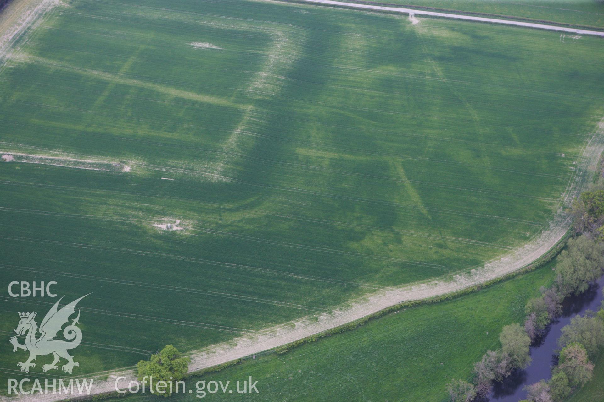 RCAHMW colour oblique photograph of Forden Gaer Roman settlement, with cropmarks showing. Taken by Toby Driver on 26/04/2011.