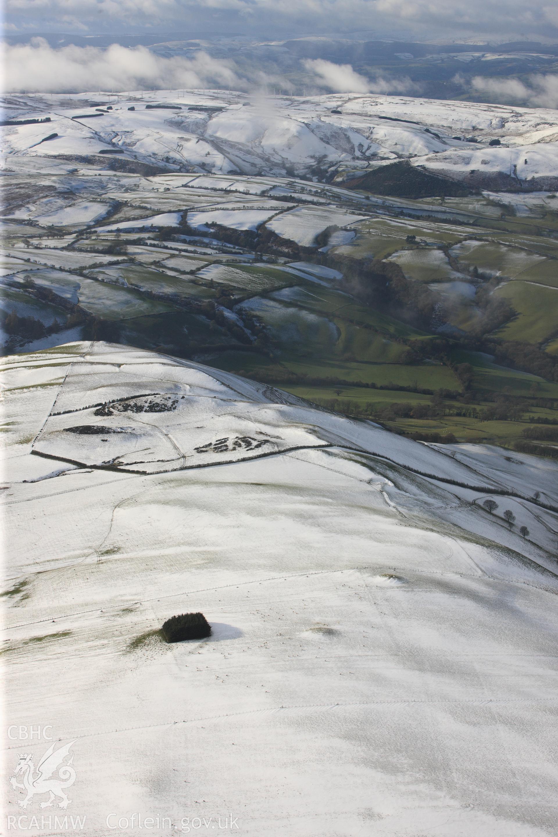 RCAHMW colour oblique photograph of Glog round barrows. Taken by Toby Driver on 18/12/2011.