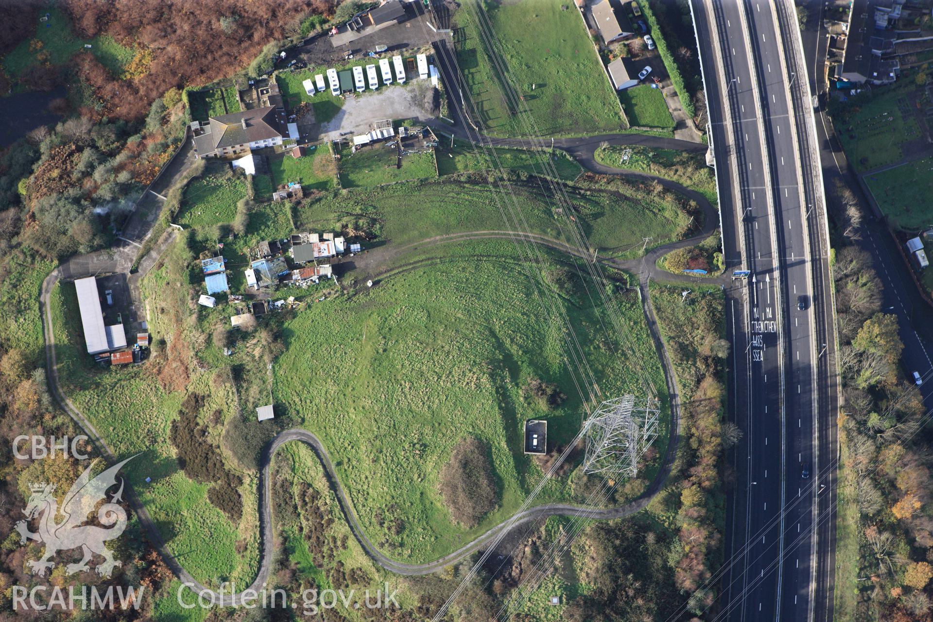 RCAHMW colour oblique photograph of Warren Hill Enclosure. Taken by Toby Driver on 17/11/2011.