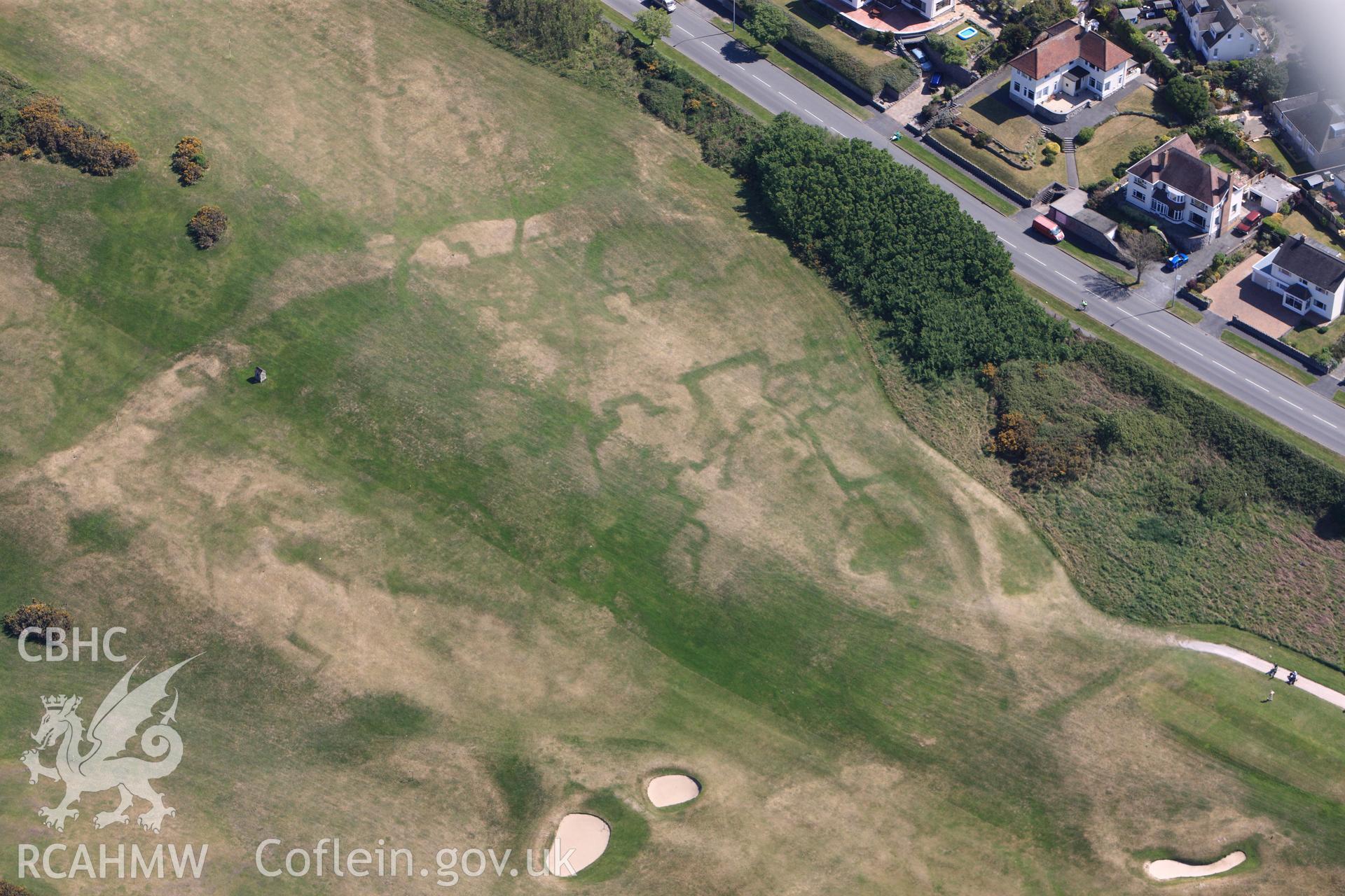 RCAHMW colour oblique photograph of Maesdu Golf Course, with parchmarks of WWI practice trenches. Taken by Toby Driver on 03/05/2011.