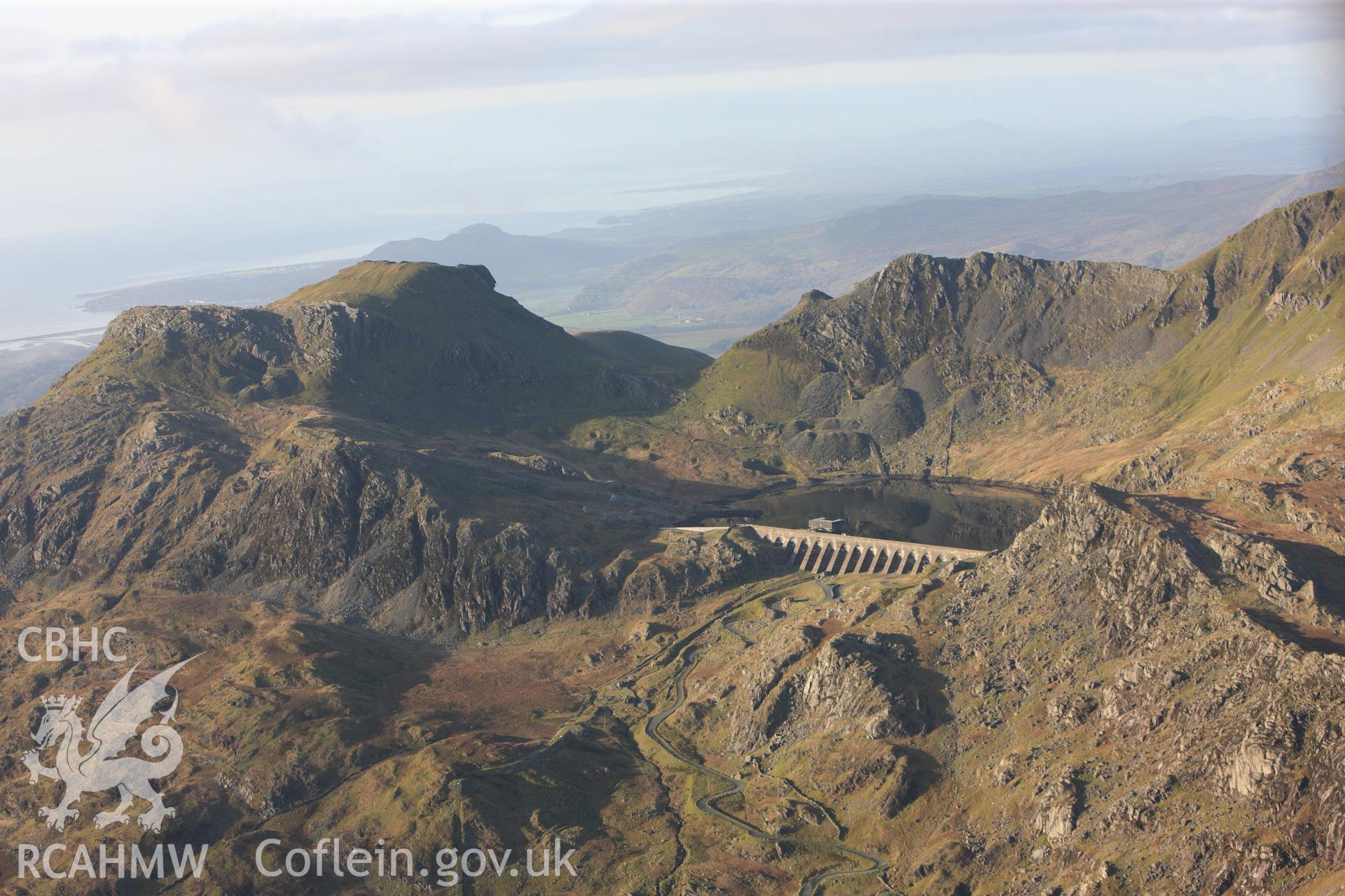 RCAHMW colour oblique photograph of Llyn Stwlan reservoir, with Moelwyn slate quarry. Taken by Toby Driver on 13/01/2012.