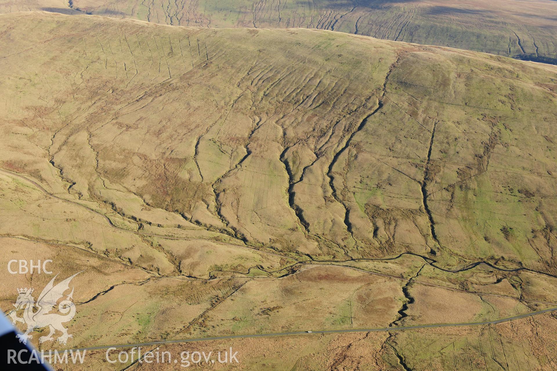 RCAHMW colour oblique photograph of Llech-Llia, multi-banked ring barrow. Taken by Toby Driver on 28/11/2012.