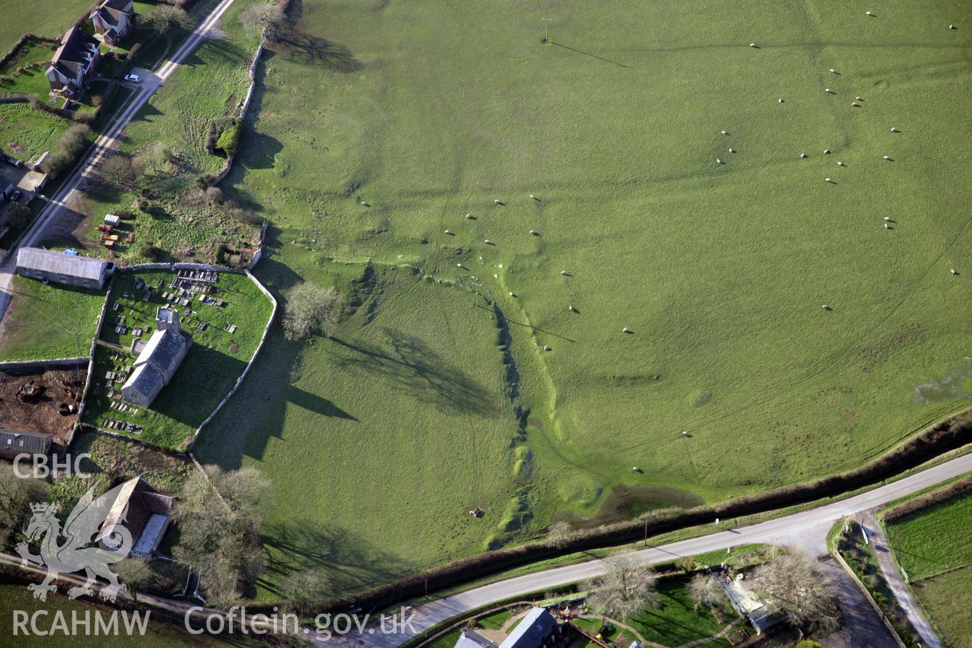 RCAHMW colour oblique photograph of Llanddewi Earthworks. Taken by Toby Driver on 02/02/2012.