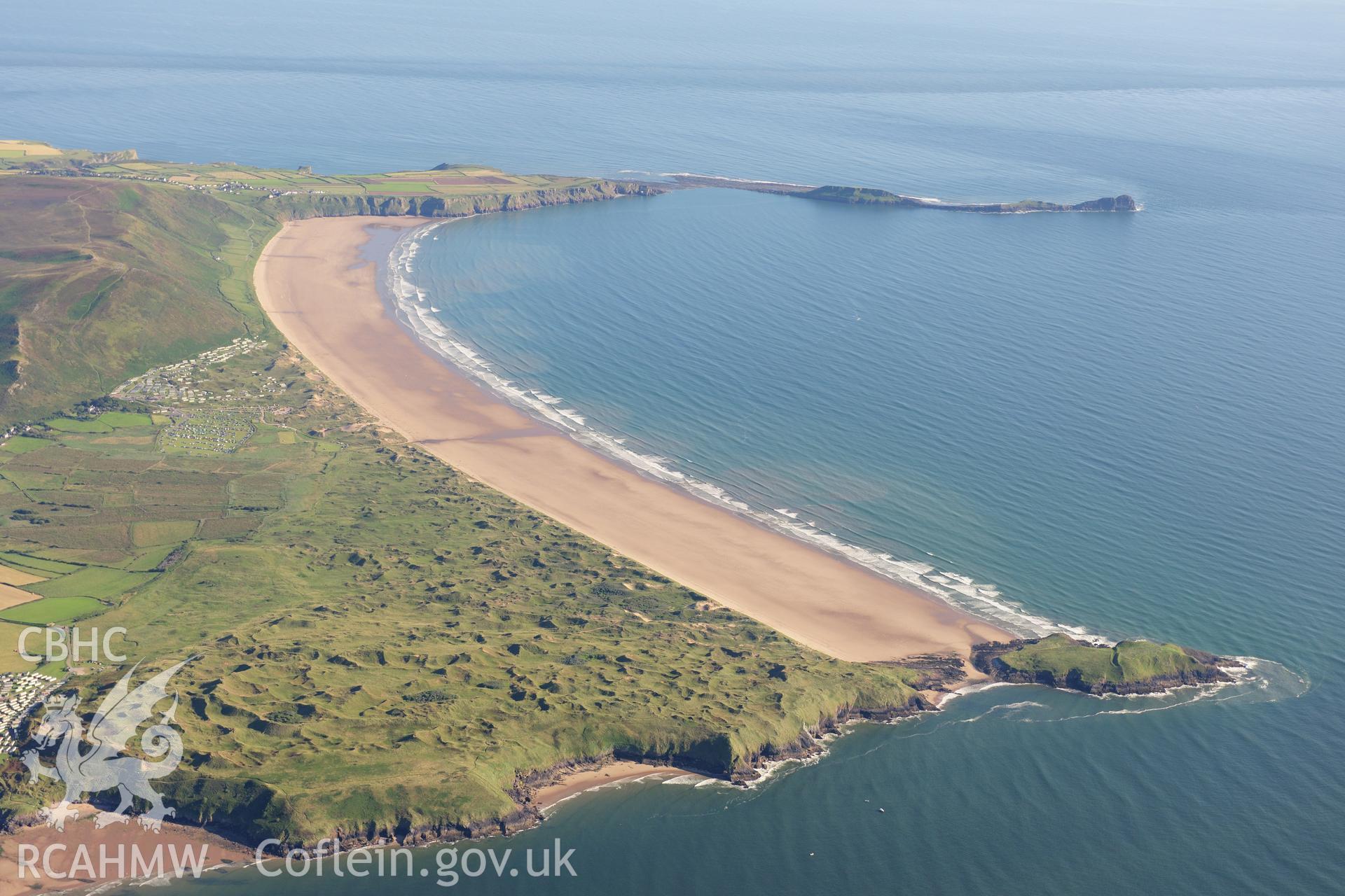 RCAHMW colour oblique photograph of West Gower, high landscape view over Rhossili Bay. Taken by Toby Driver on 24/07/2012.