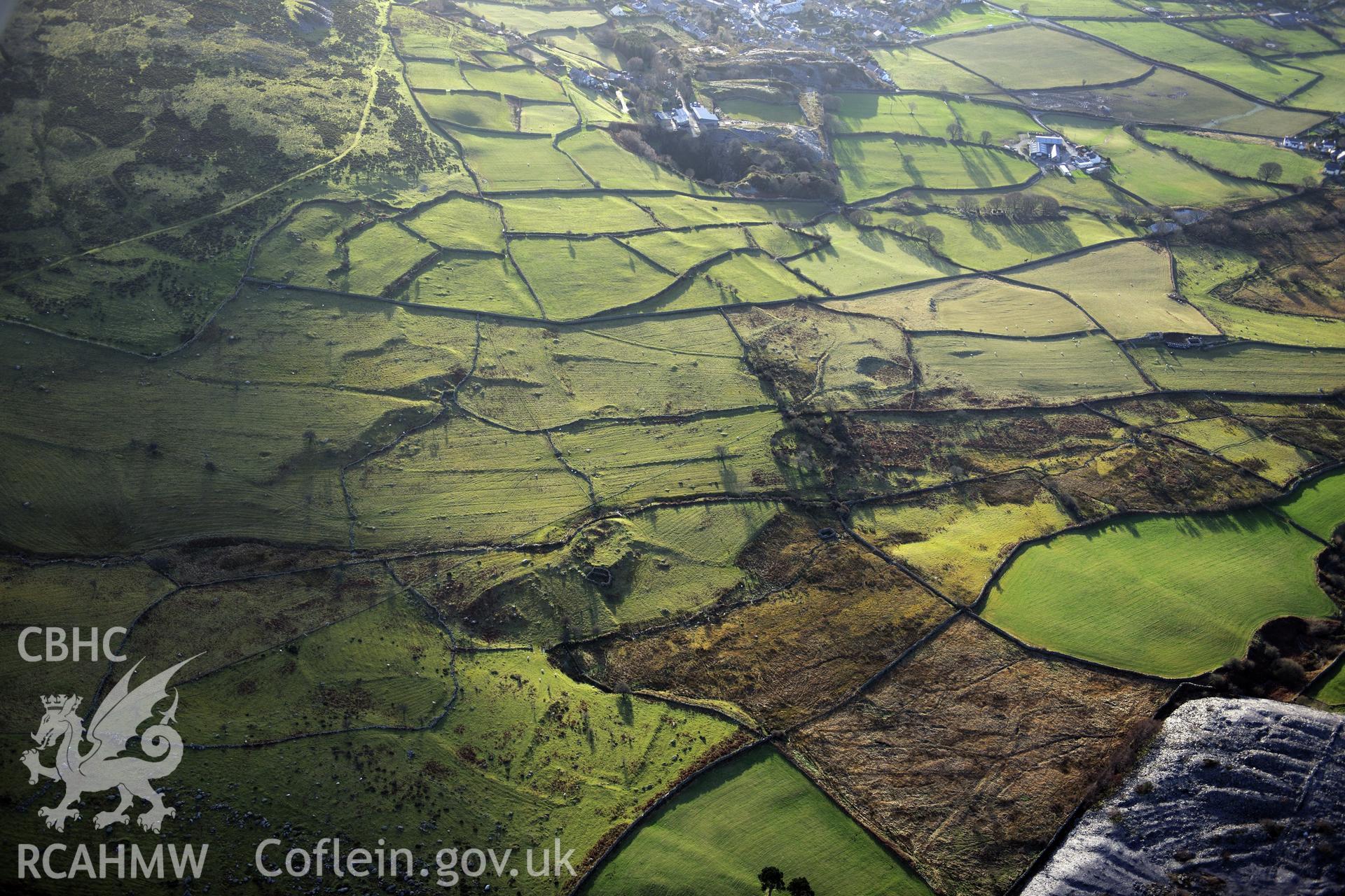 RCAHMW colour oblique photograph of Moel Faban early agricultural landscape, Llanllechid. Taken by Toby Driver on 10/12/2012.