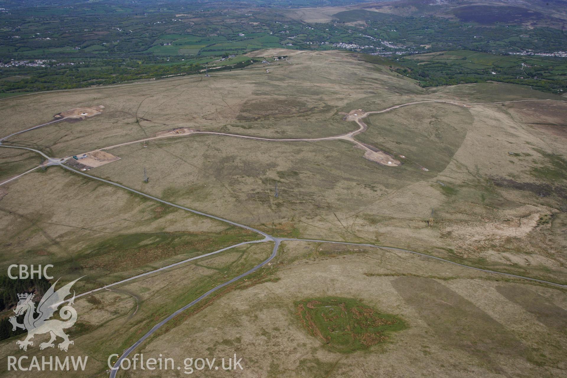 RCAHMW colour oblique photograph of Penlle'r Castell, and Mynydd y Betws windfarm, under construction.View looking north. Taken by Toby Driver on 22/05/2012.