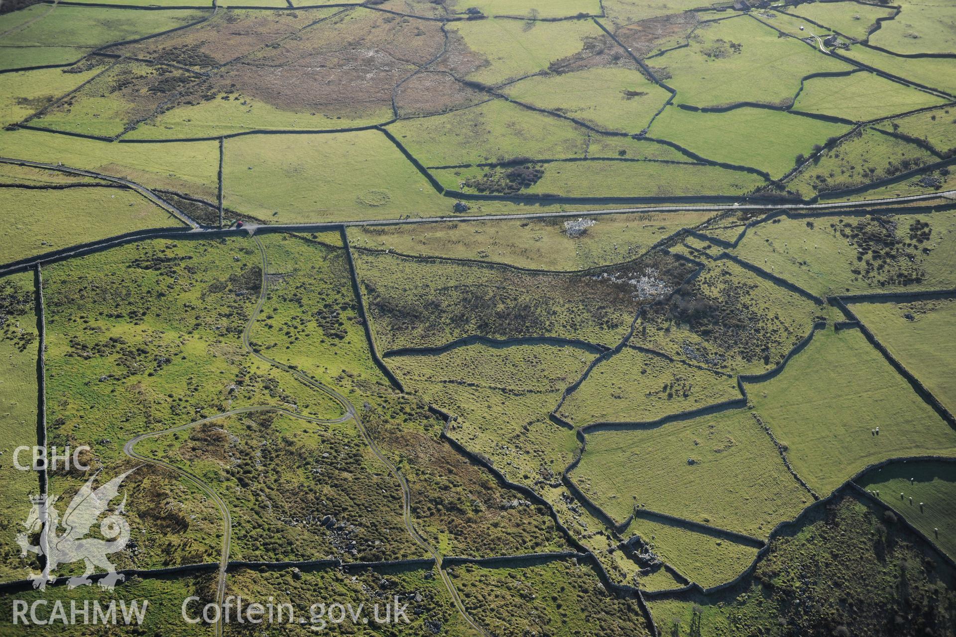 RCAHMW colour oblique photograph of Garreg round cairn, and standing stone, and field systems to north. Taken by Toby Driver on 10/12/2012.