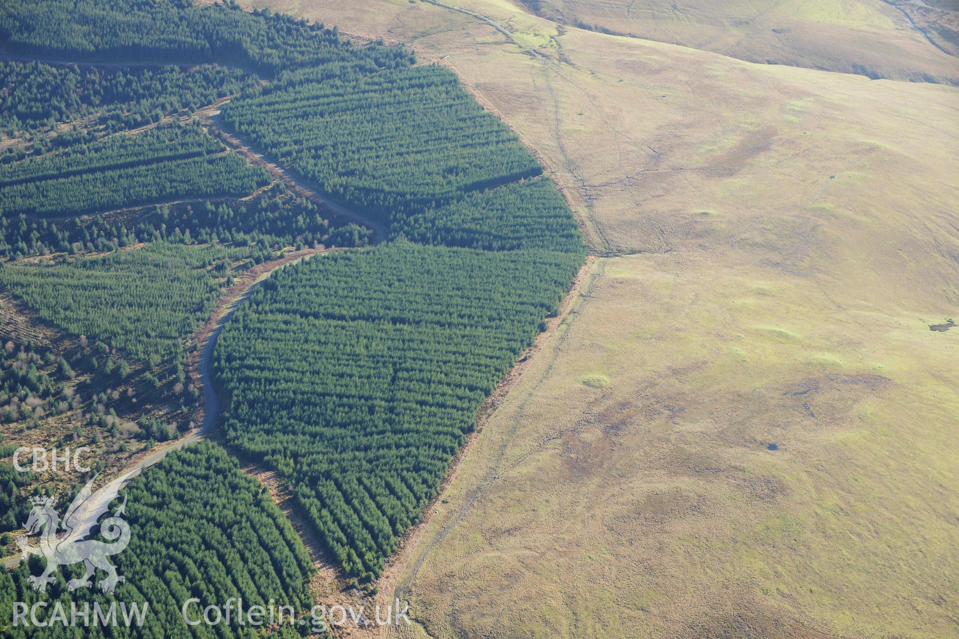 RCAHMW colour oblique photograph of Cefn Llwyd round barrow and quartz boulder. Taken by Toby Driver on 05/11/2012.