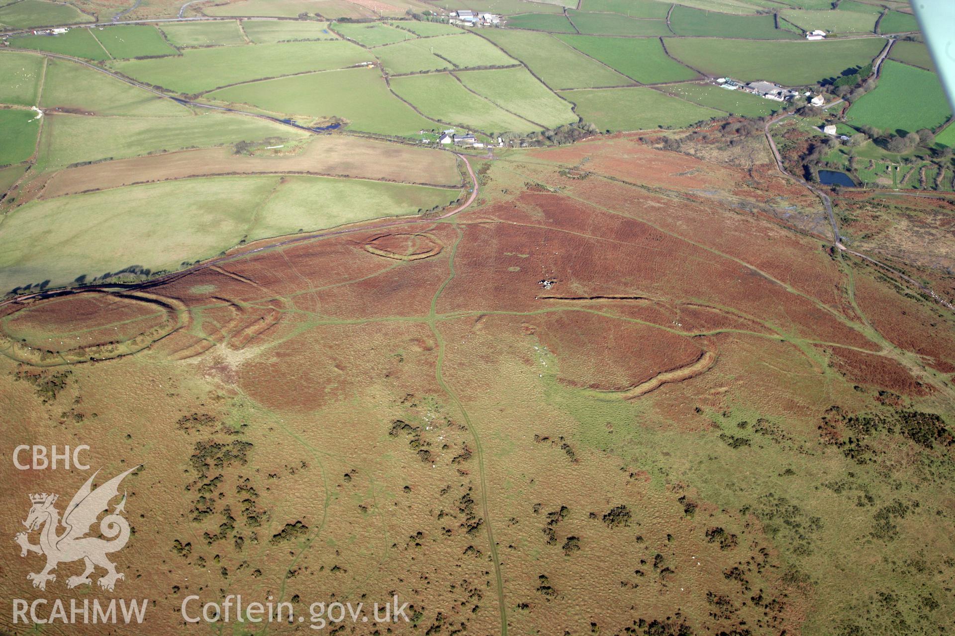 RCAHMW colour oblique photograph of Three Camps On Hardings Down. Taken by Toby Driver on 02/02/2012.