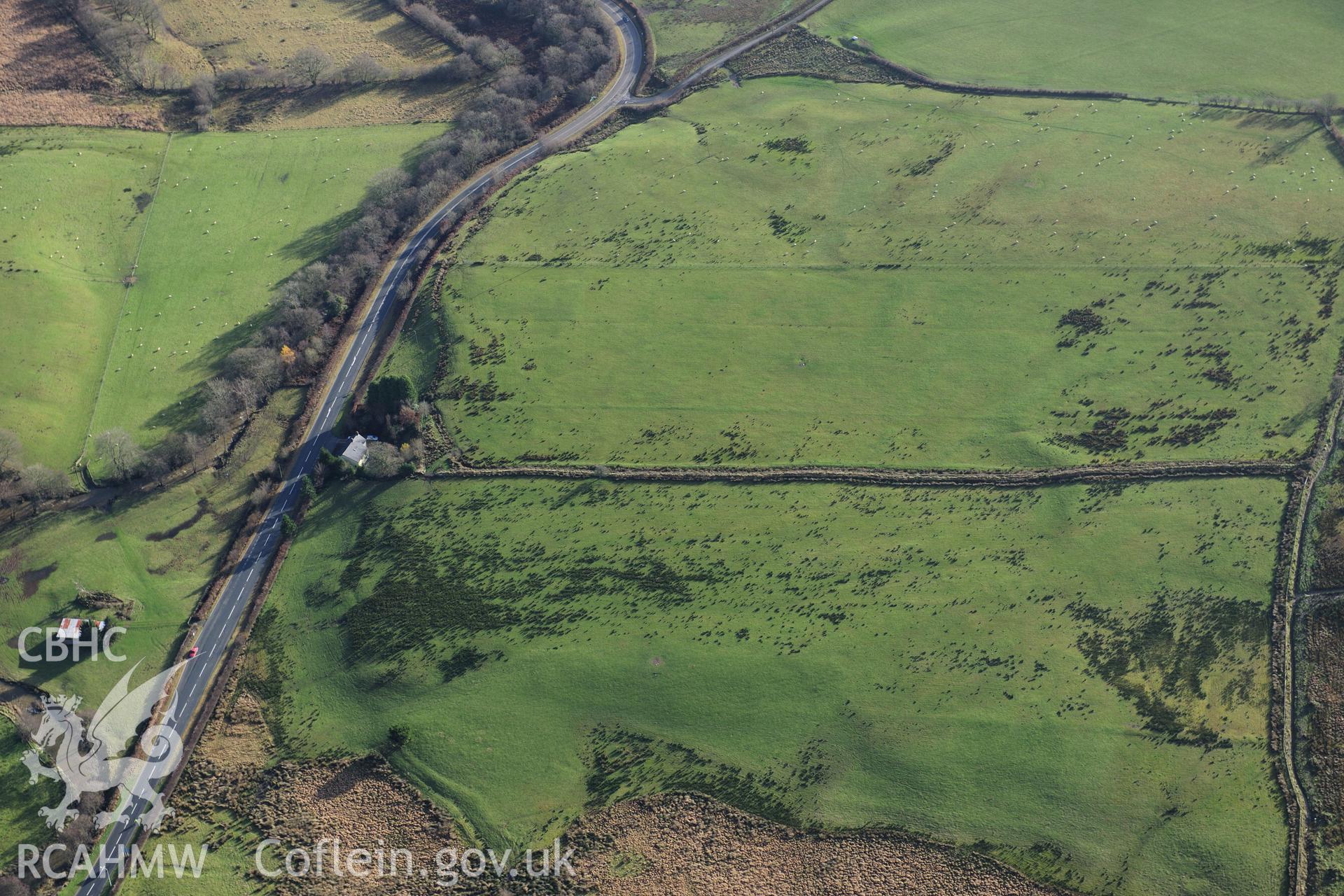 RCAHMW colour oblique photograph of Roman camps north of Caerau, Beulah (site of). Taken by Toby Driver on 23/11/2012.