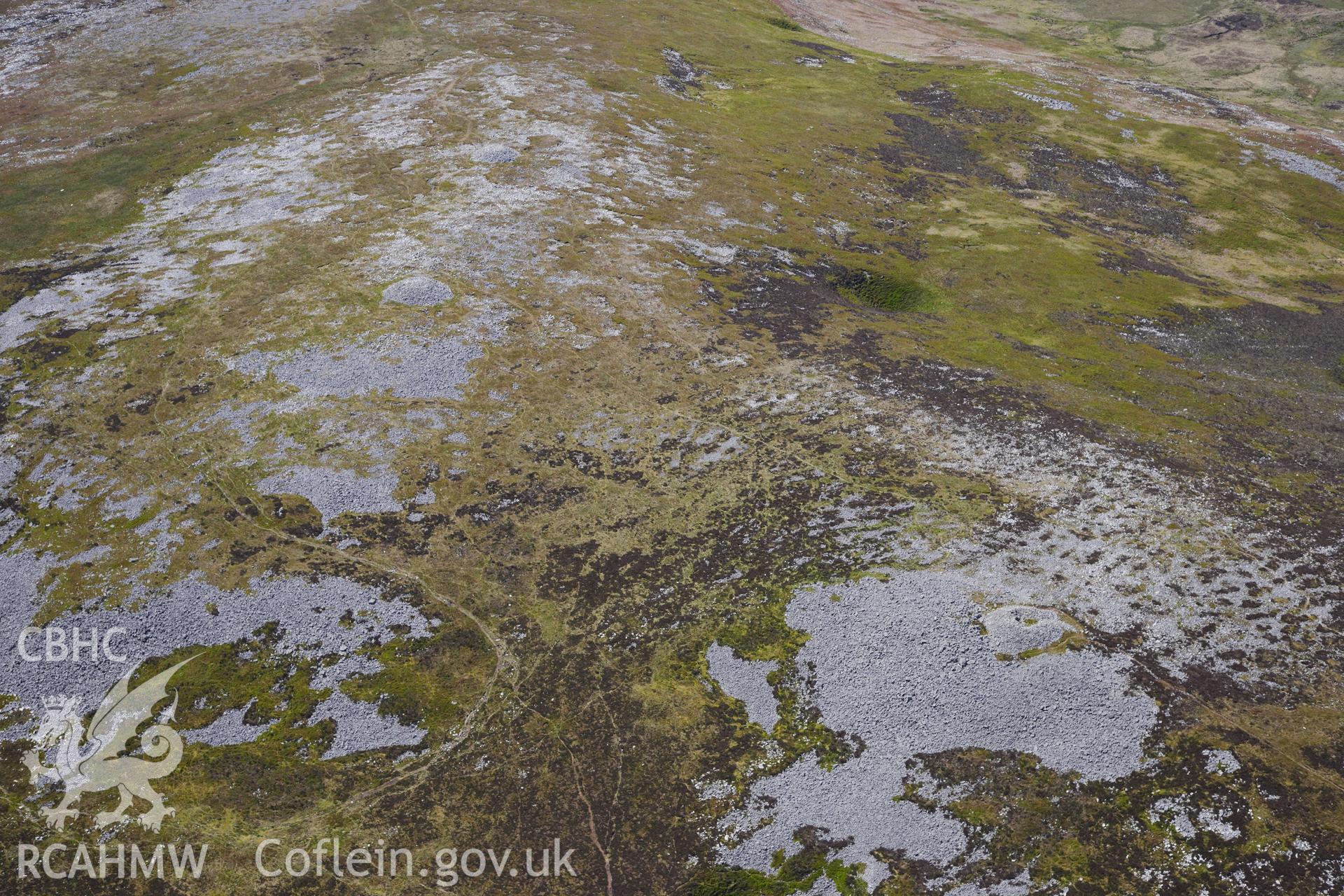 RCAHMW colour oblique photograph of Tair Carn Uchaf cairns, view from south-east. Taken by Toby Driver on 22/05/2012.